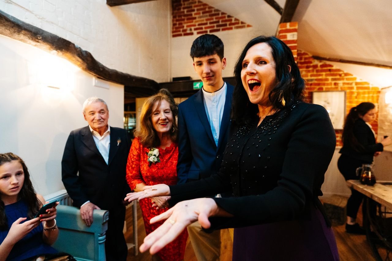 Guests looking amazed from Alfie's mix and mingle magic