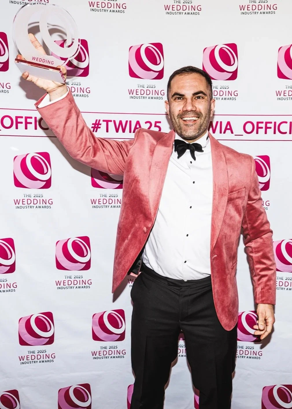 Magic by Alfie holding the UK Wedding Magician of the Year Trophy