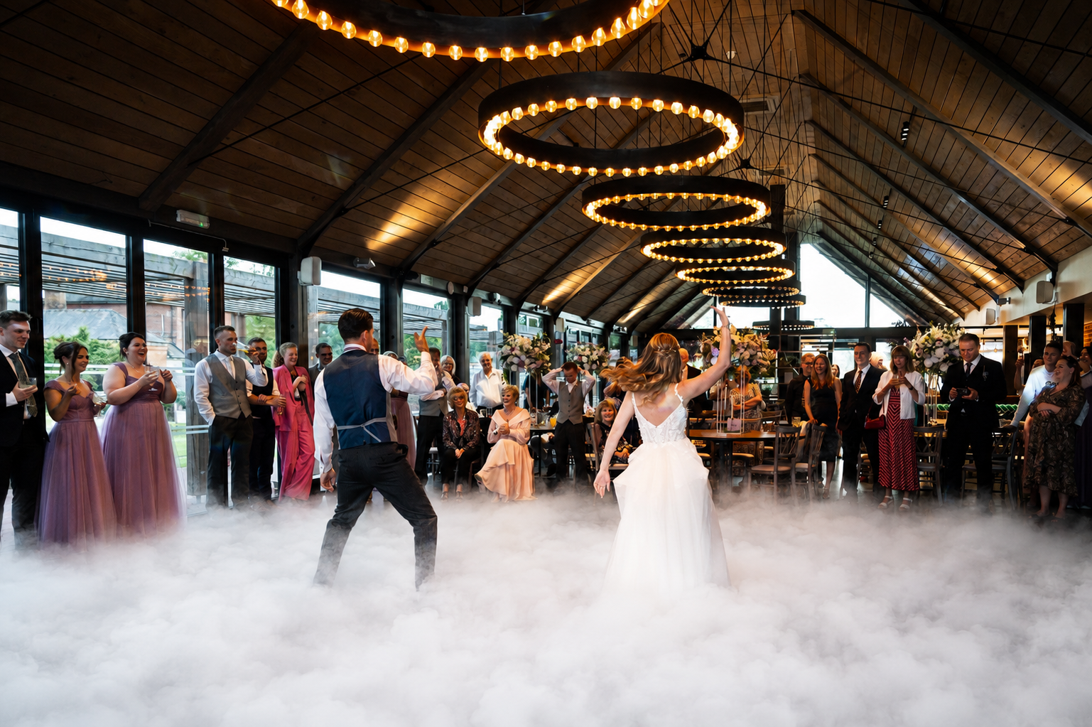 Bride and groom first dance with dry ice effect at Syrencot barn wedding venue