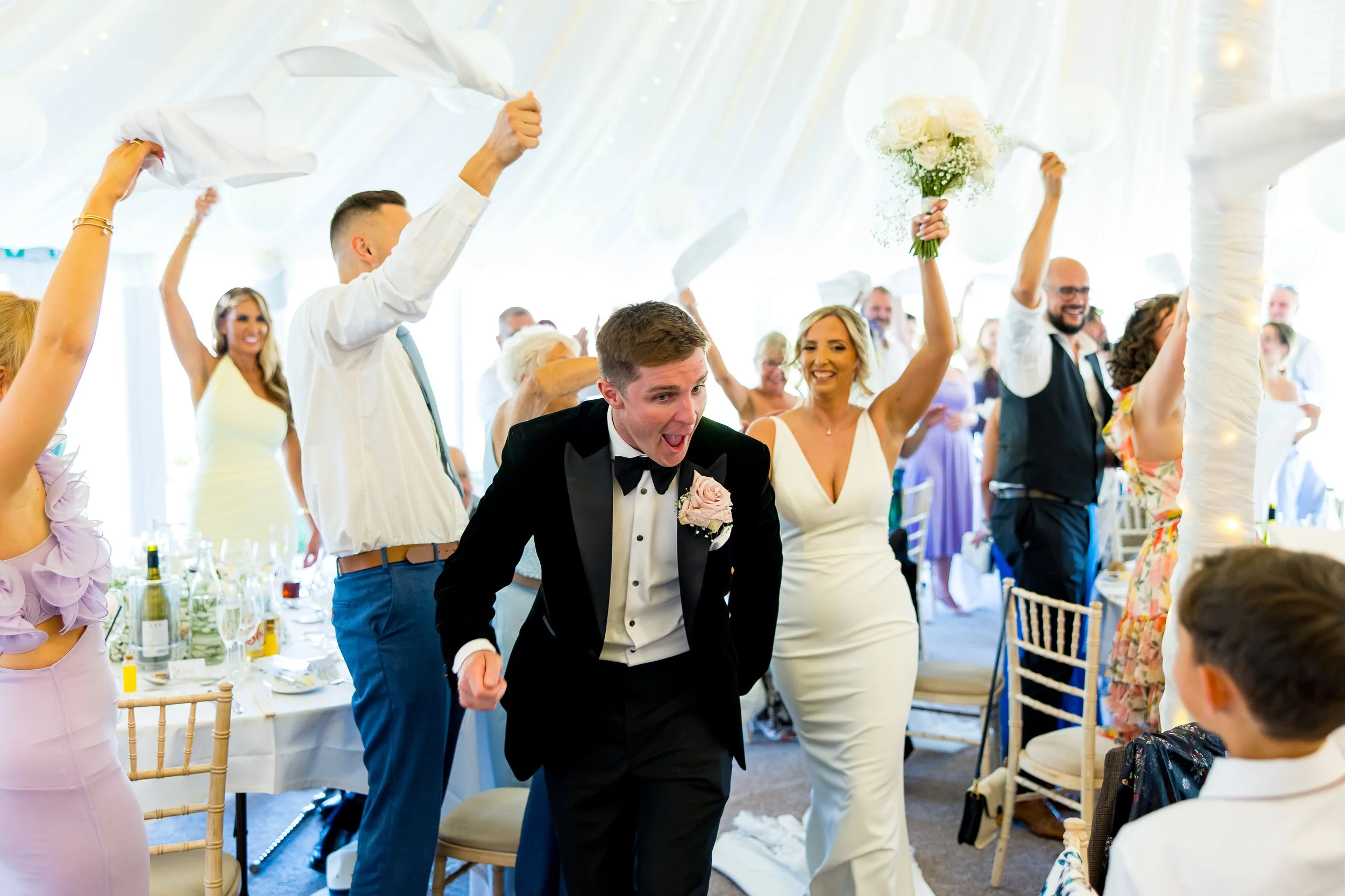 Wedding host leading lively wedding breakfast at Parley Manor, Dorset