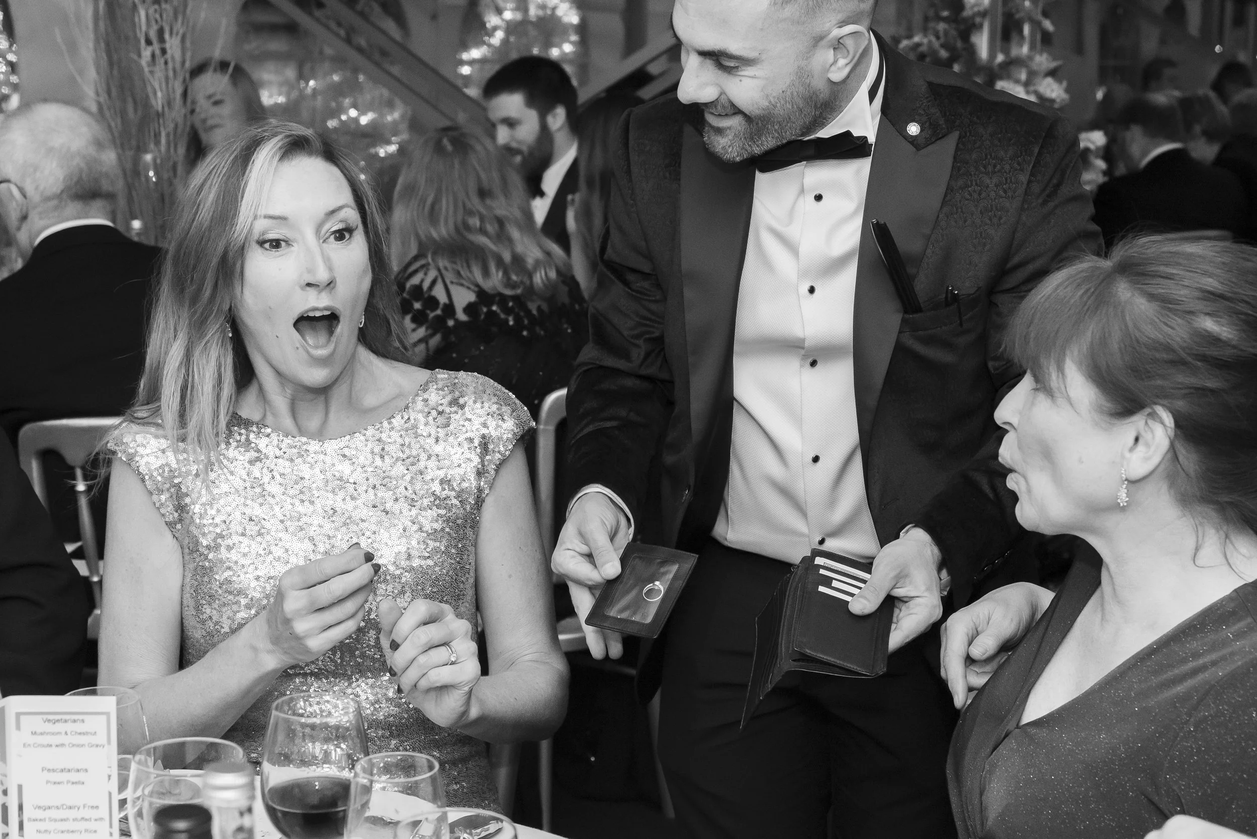 Corporate magician Alfie entertaining guests at a gala dinner