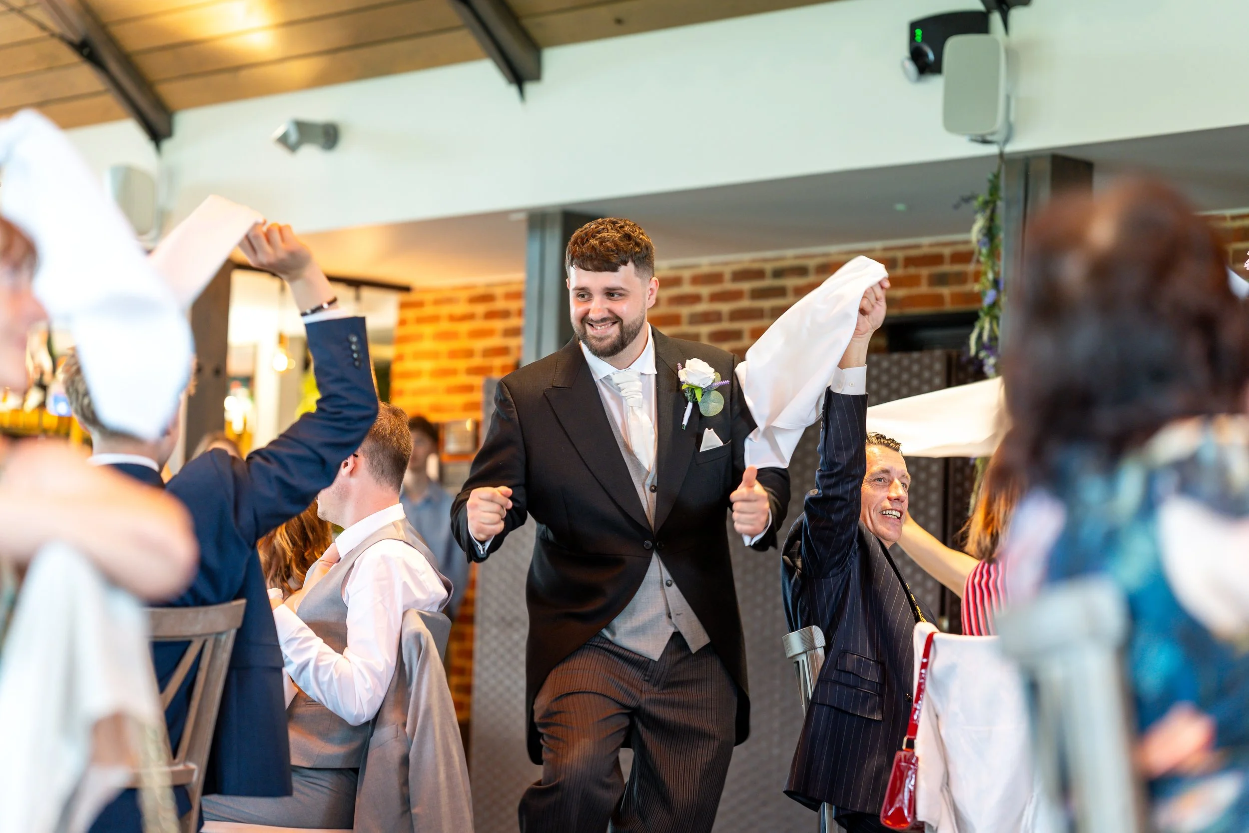 Best man being introduced into the wedding breakfast