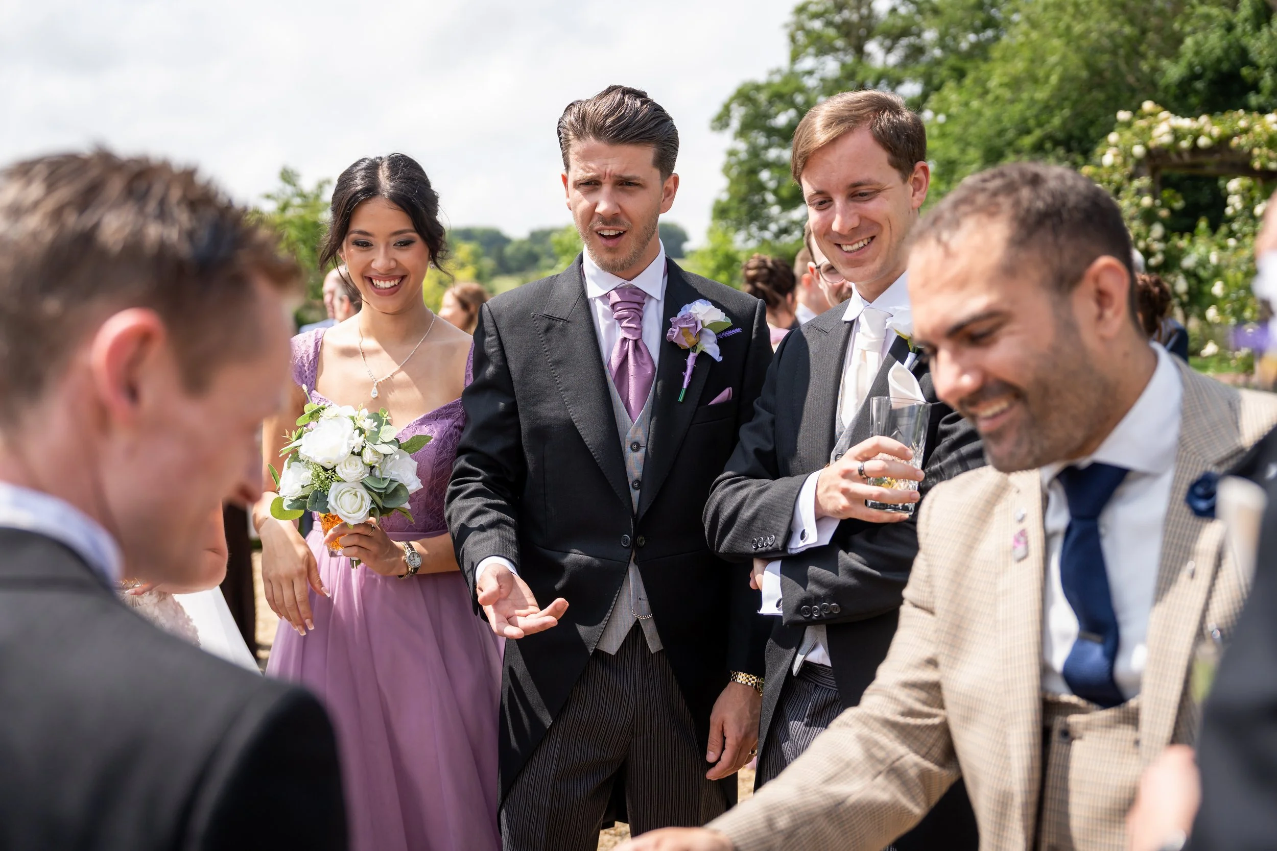 Professional magician performing close-up magic for guests at a Somerset wedding or event venue