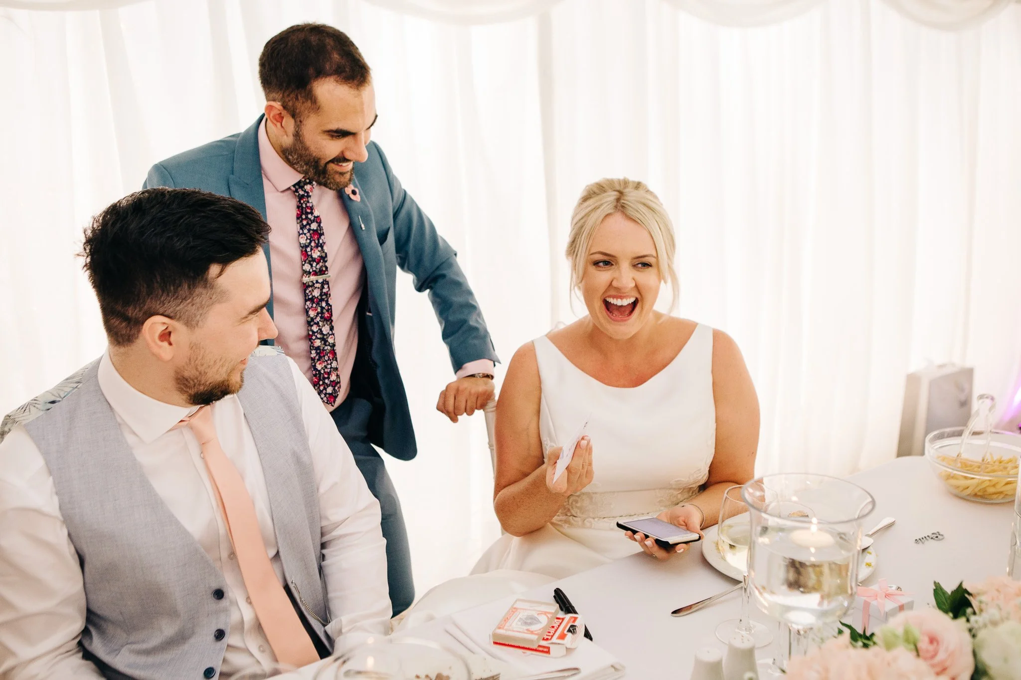 Close up magician performing for bride & groom at Parley Manor
