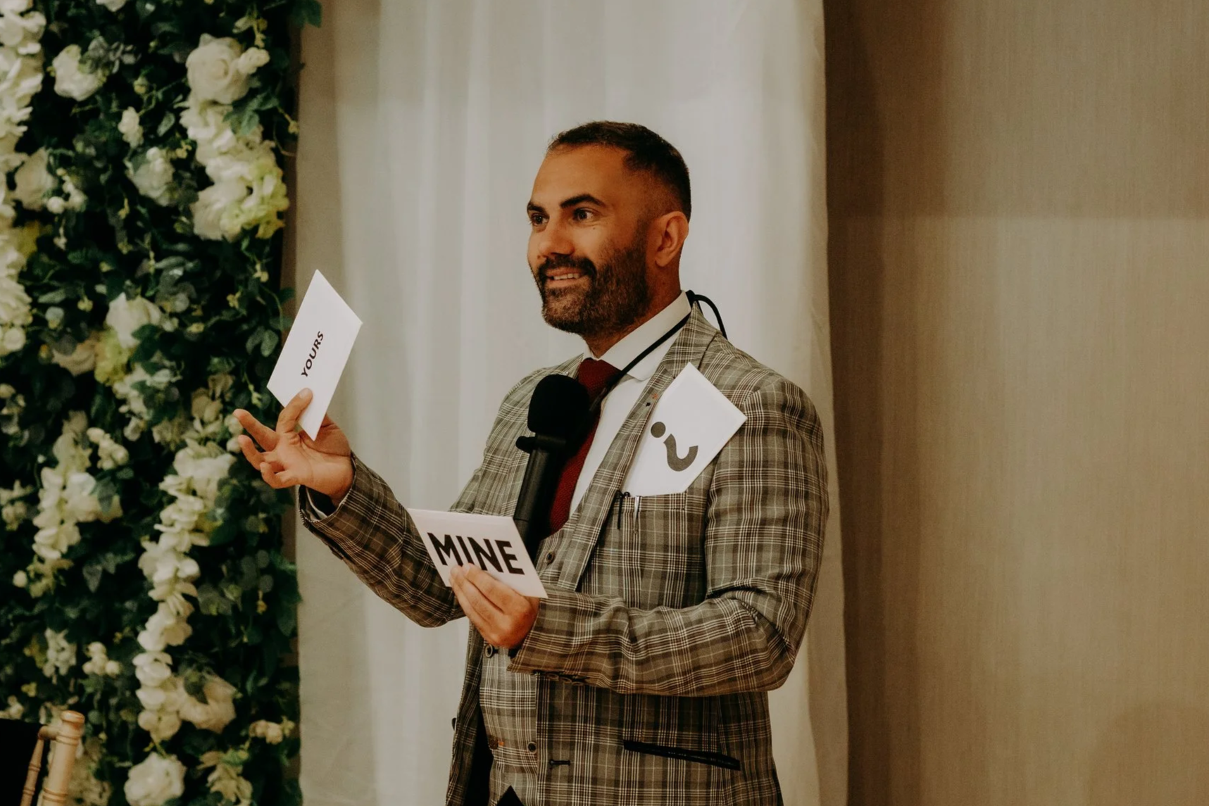 Corporate magician performing cabaret stage magic to a seated audience at a corporate dinner