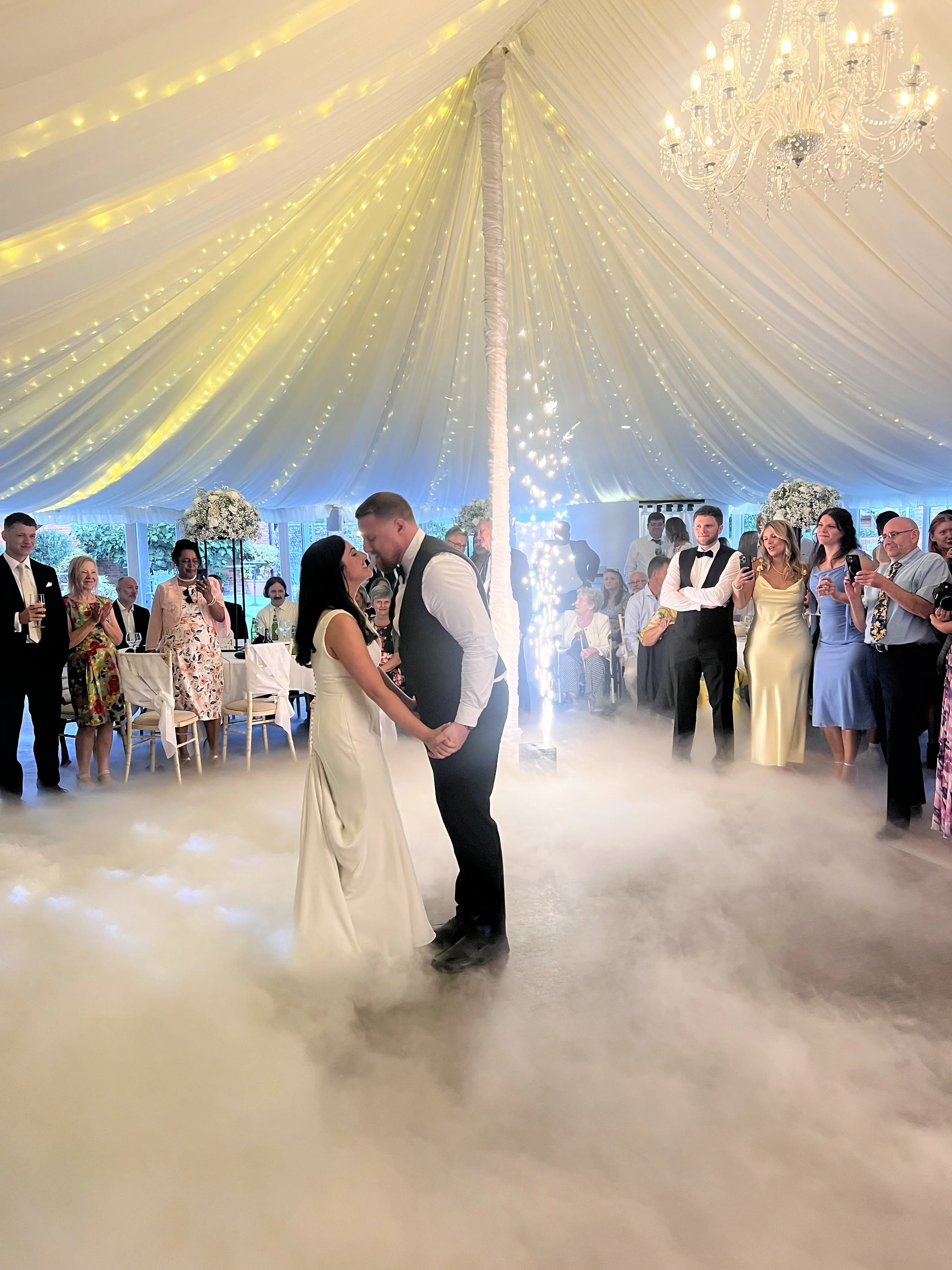 Bride and groom dancing on dry ice with cold sparks at Parley Manor Dorset