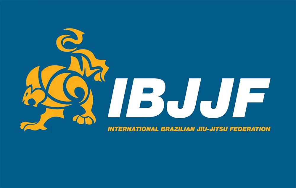 Logo of the International Brazilian Jiu-Jitsu Federation with a stylized golden lion and the text IBJJF in bold white letters, along with the full name written below in smaller yellow font.