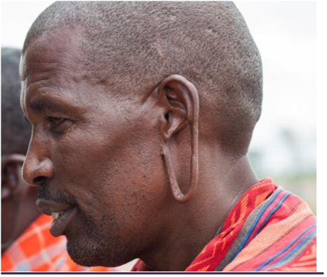 a headshot photo of a Masai