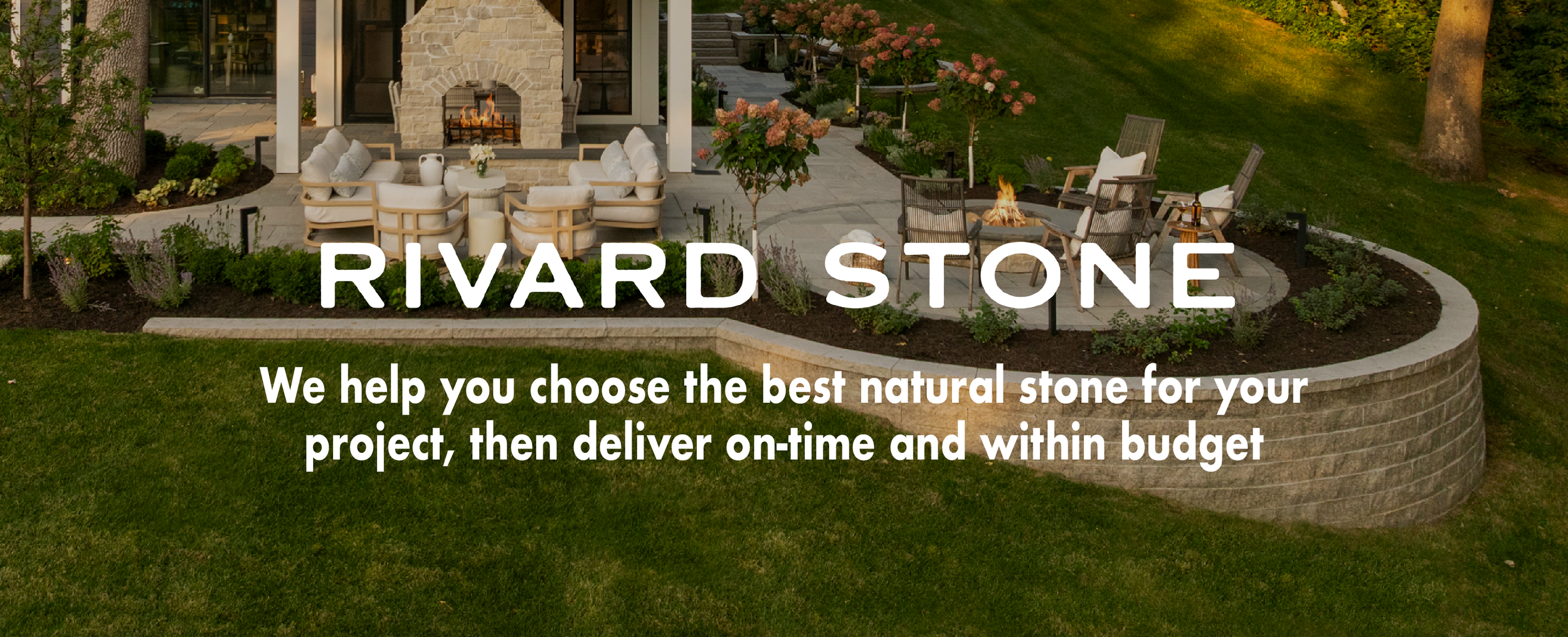 Beautiful backyard patio with outdoor furniture, fire pit, and landscaped garden, overlooking a lawn.