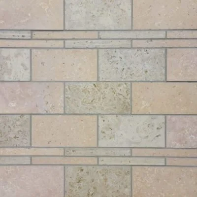 Close-up of beige brick wall with horizontal painted lines.