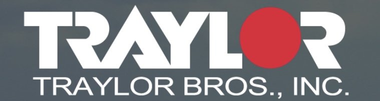 Logo of TRAYLOR BROS., INC. with the word TRAYLOR in large white letters and a red circle replacing the letter O.