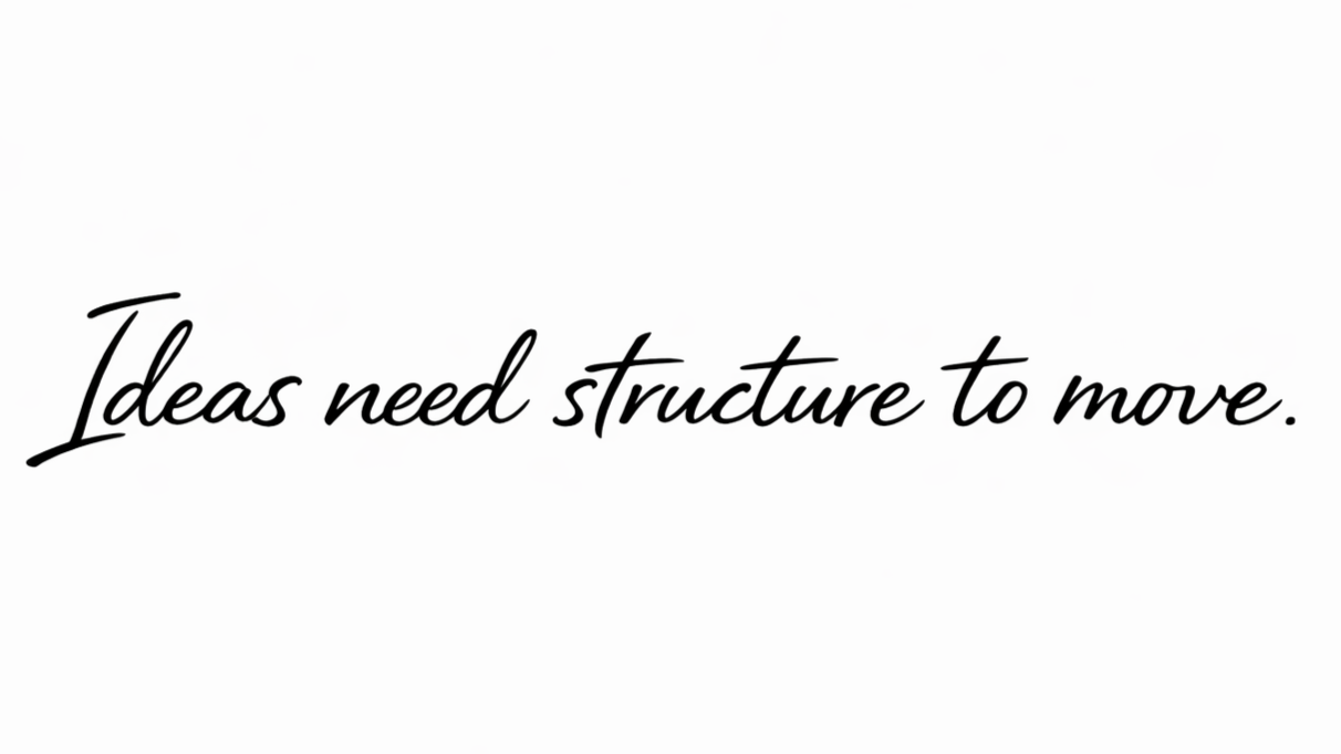 Handwritten script text reading “Ideas need structure to move.”