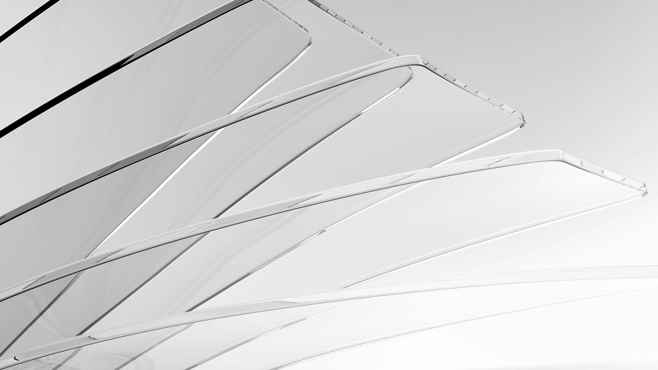 A modern building with a series of curved, overlapping glass or metal panels, creating an abstract architectural design in black and white.