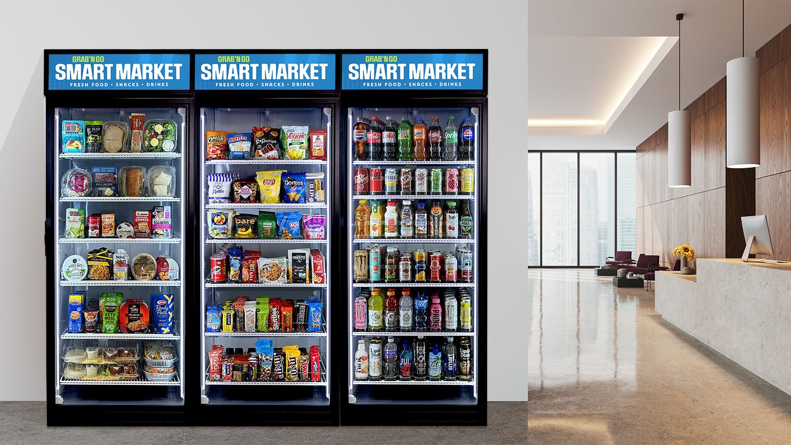 Three vending machines, smartmarket coolers, filled with snacks, drinks, and quick meals in a modern lobby with seating and large windows.