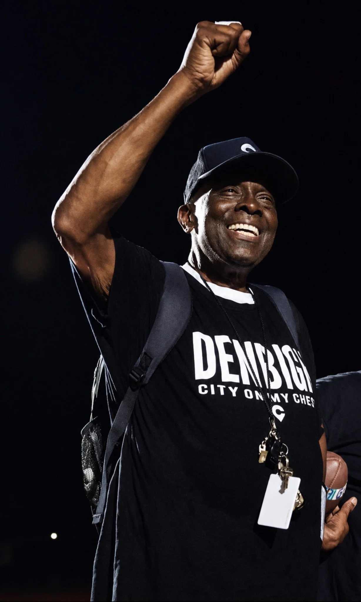 Tommy Reamon Sr. smiling with his fist raised