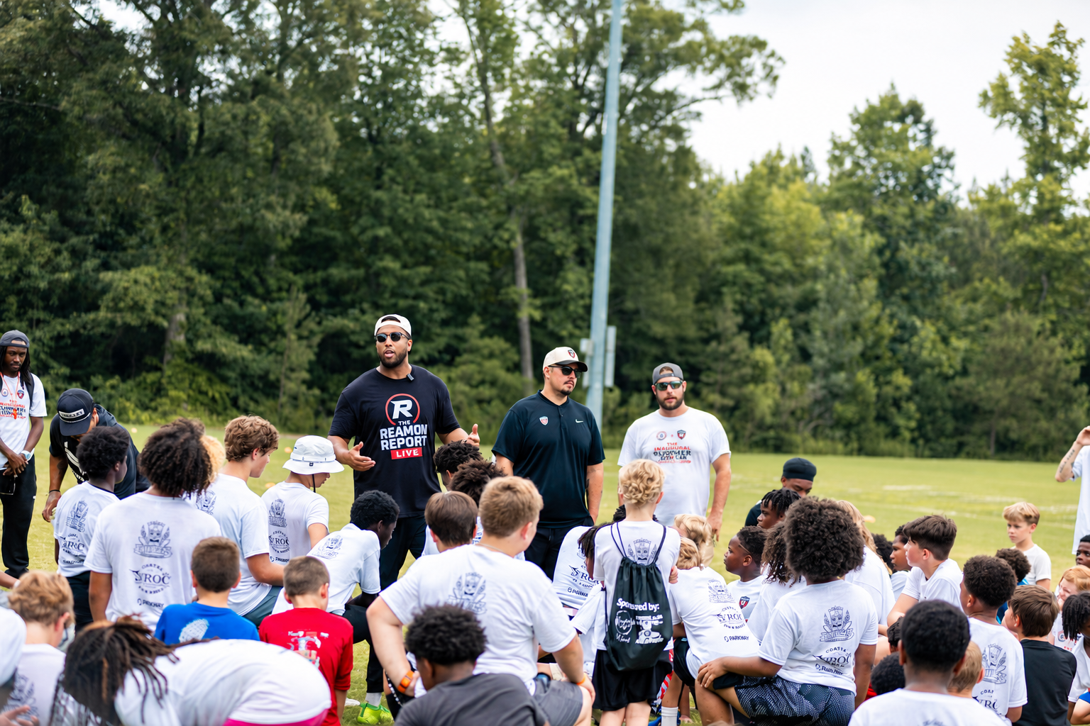 Coaches addressing participants at the Foundation Youth Football Camp.