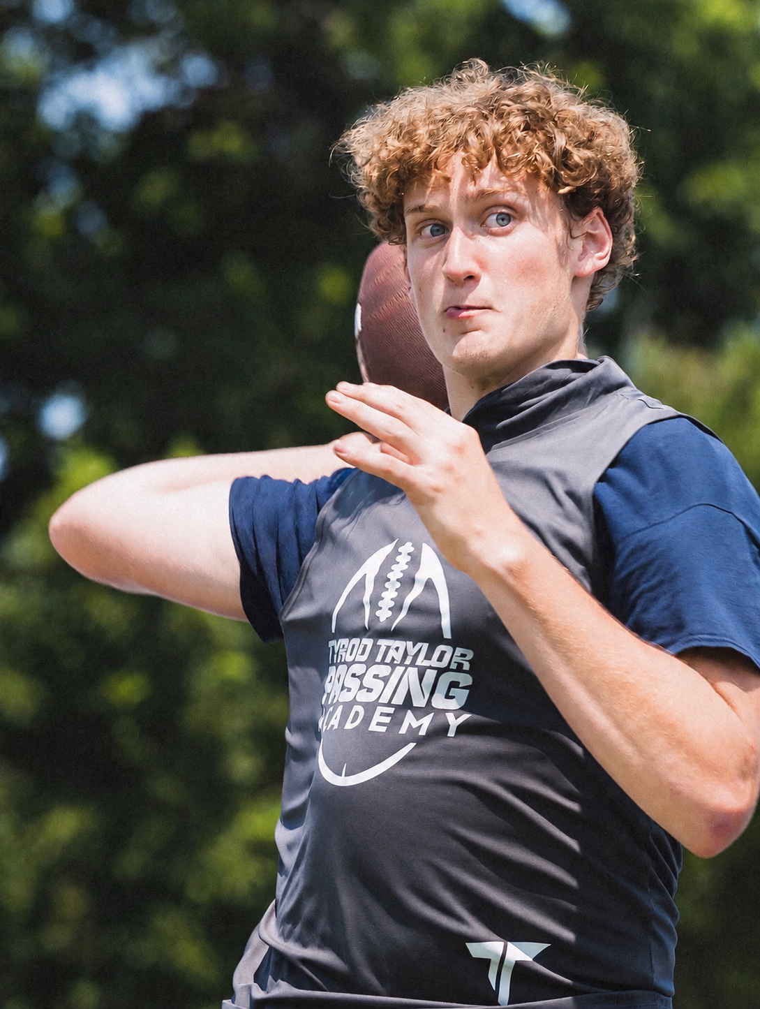 A quarterback practicing passing mechanics at the academy.