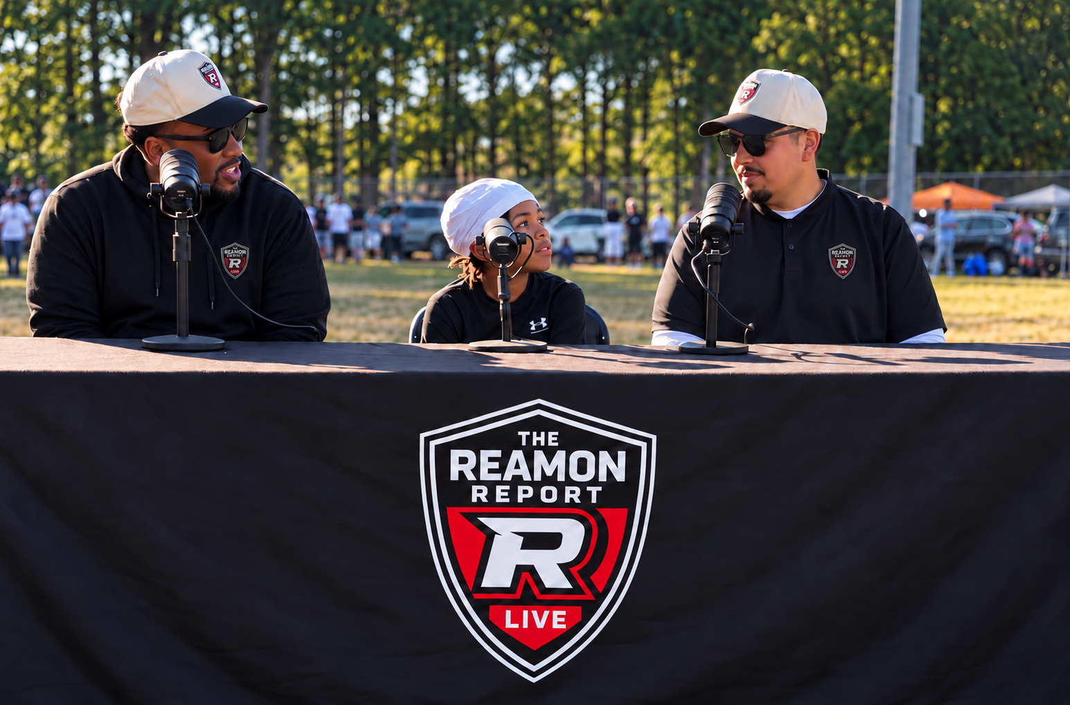 A young athlete sharing a conversation with Tommy Reamon and Wesley West at The Reamon Report Live