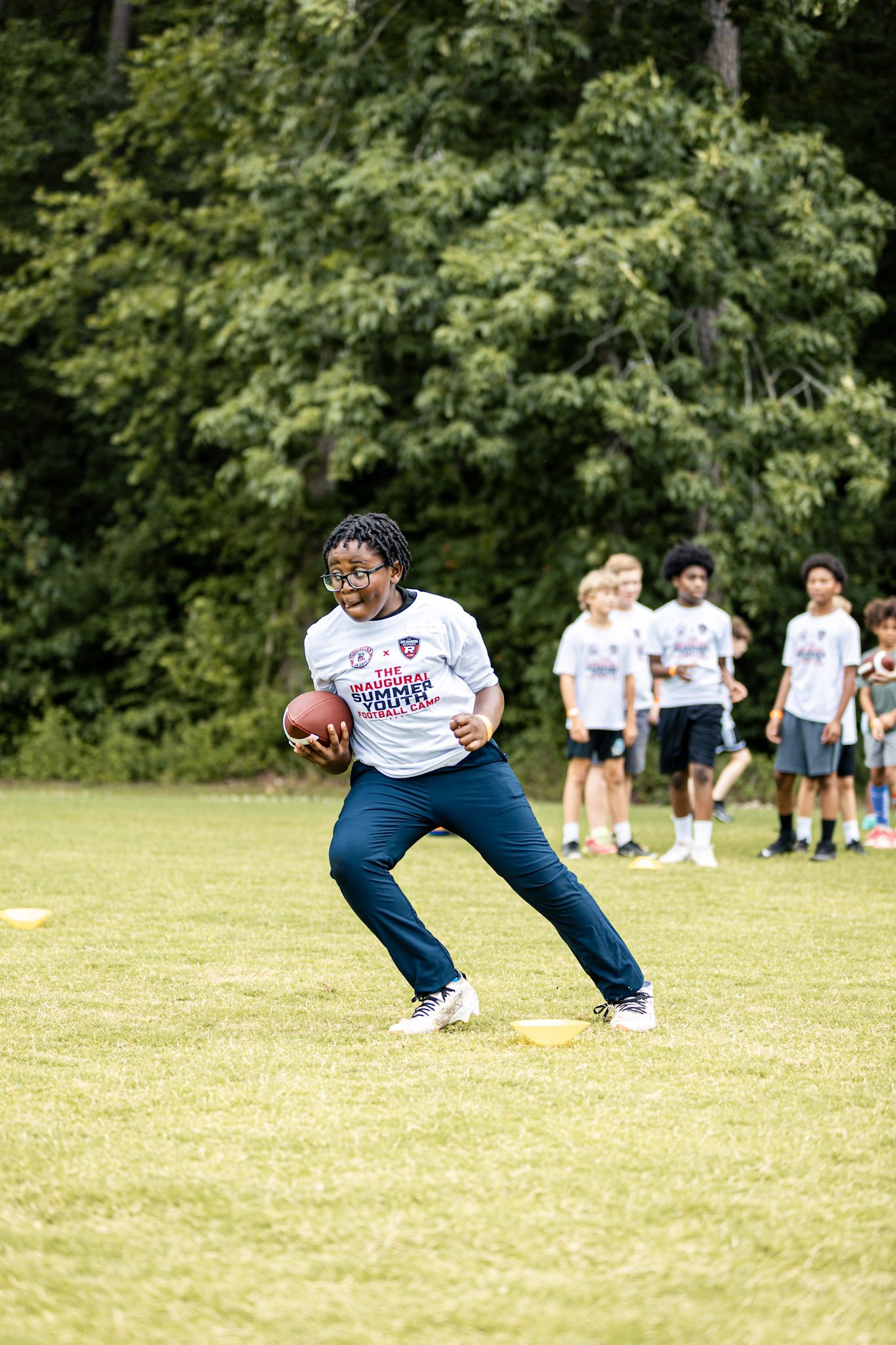 A camper developing ball-carrying skills.