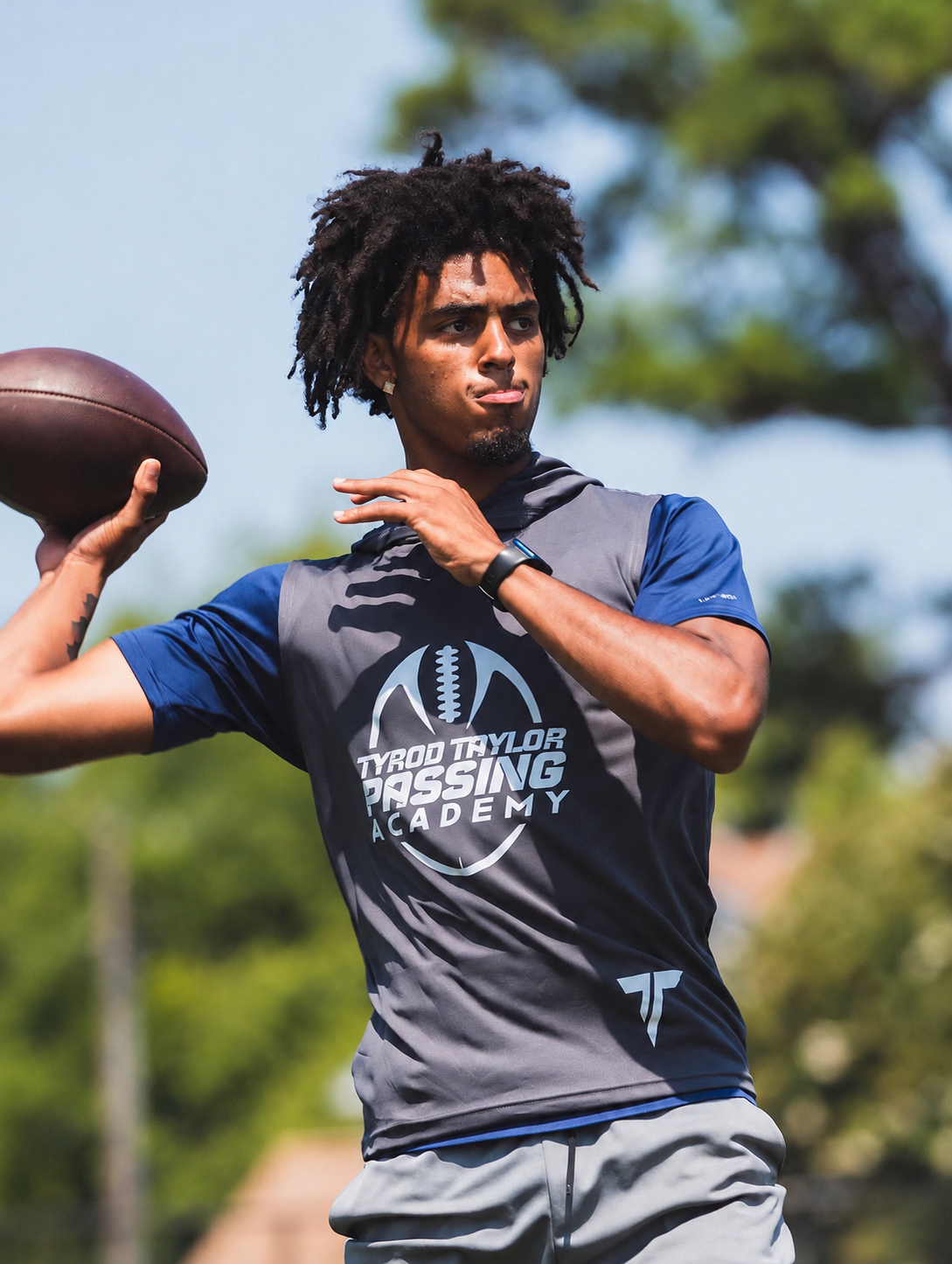 A quarterback working through a throwing drill.