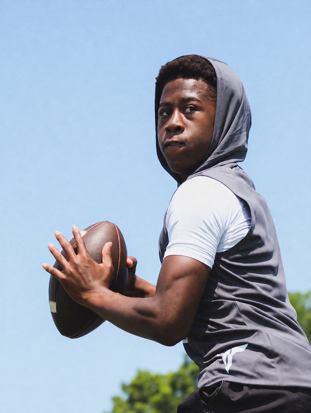 A quarterback preparing for an on-field passing drill.