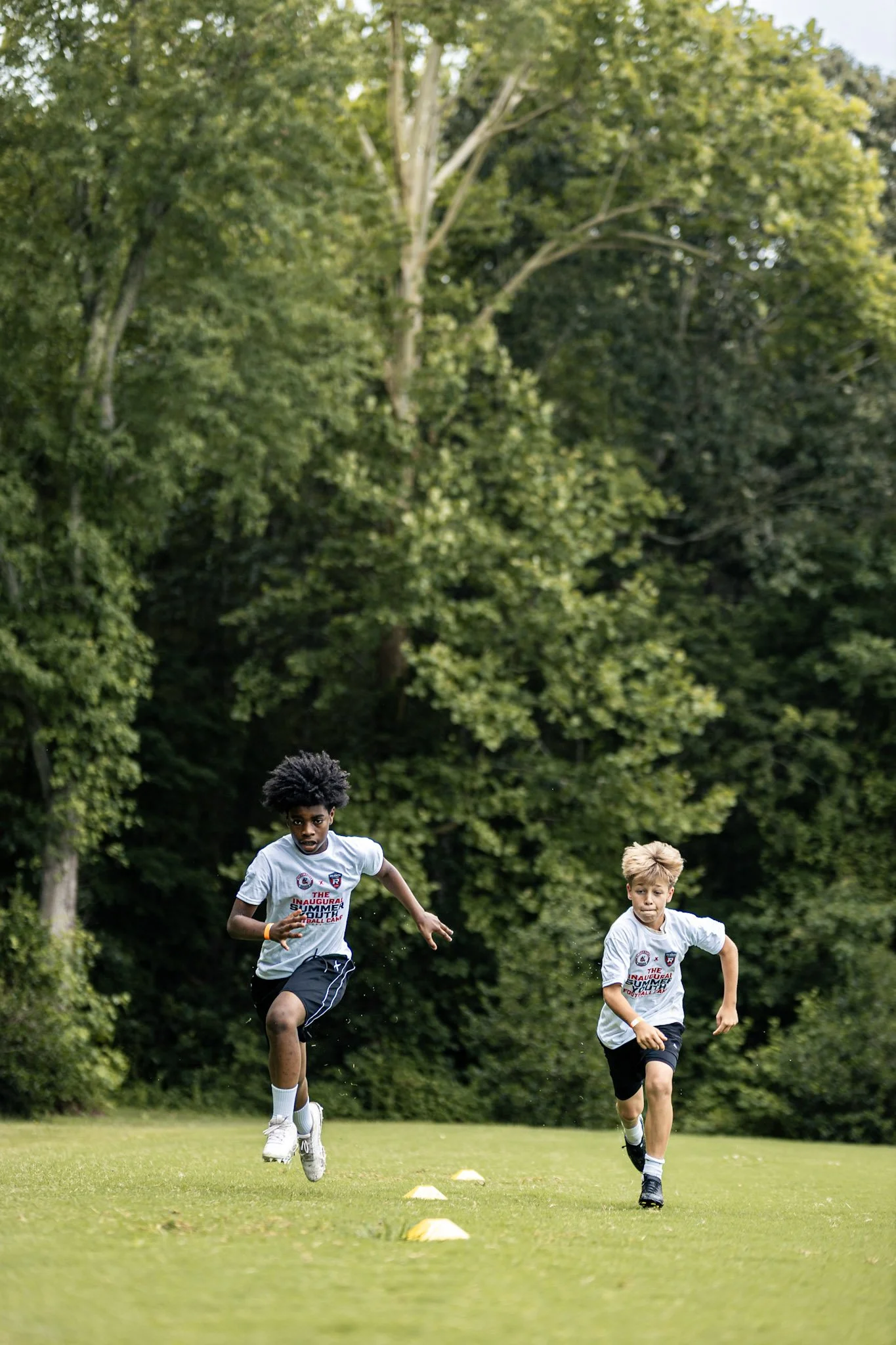 Campers running through an agility drill.