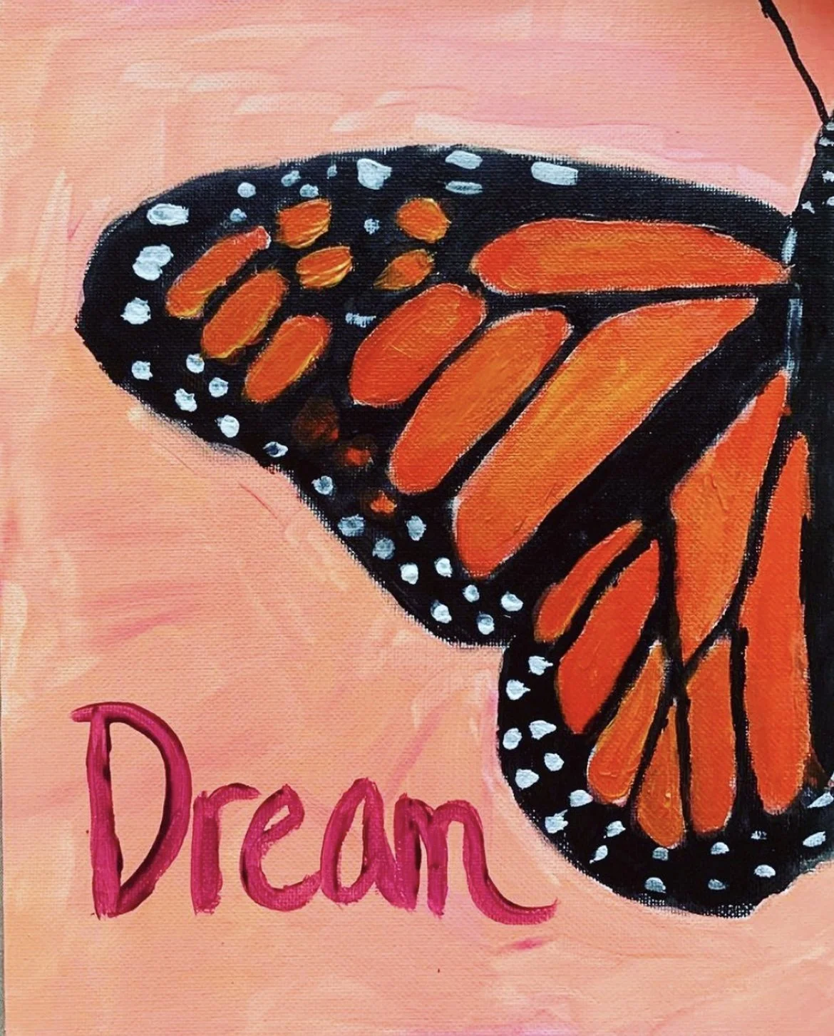 Dream in Motion: A soft yet vivid butterfly wing floats across a warm, peach-toned background, symbolizing transformation, imagination, and becoming. This piece captures a quiet moment of change—where growth feels gentle rather than rushed.