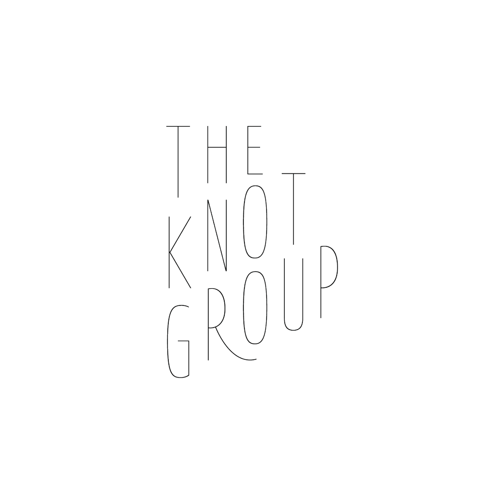 Black background with white outlined text reading "The Not Group" in a stylized font.