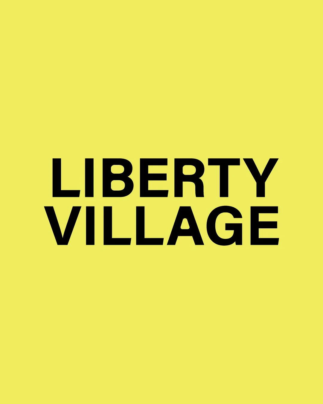 Yellow background with bold black text that reads 'Liberty Village'.