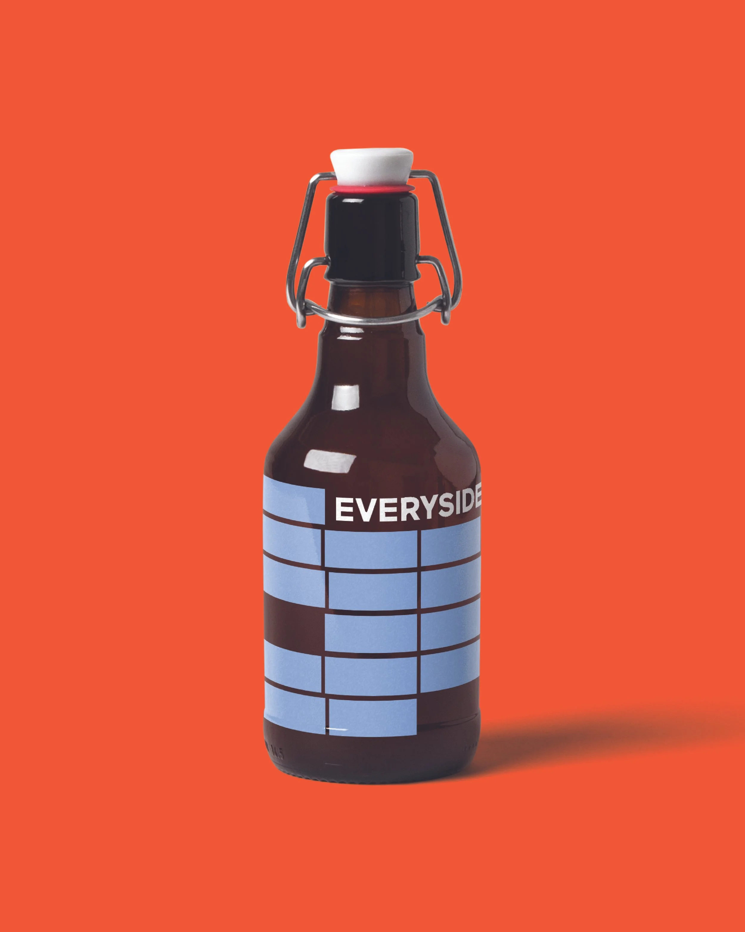 A brown glass bottle with a swing top cap, labeled with a blue chart and the word 'EVERYDAY', on an orange background.