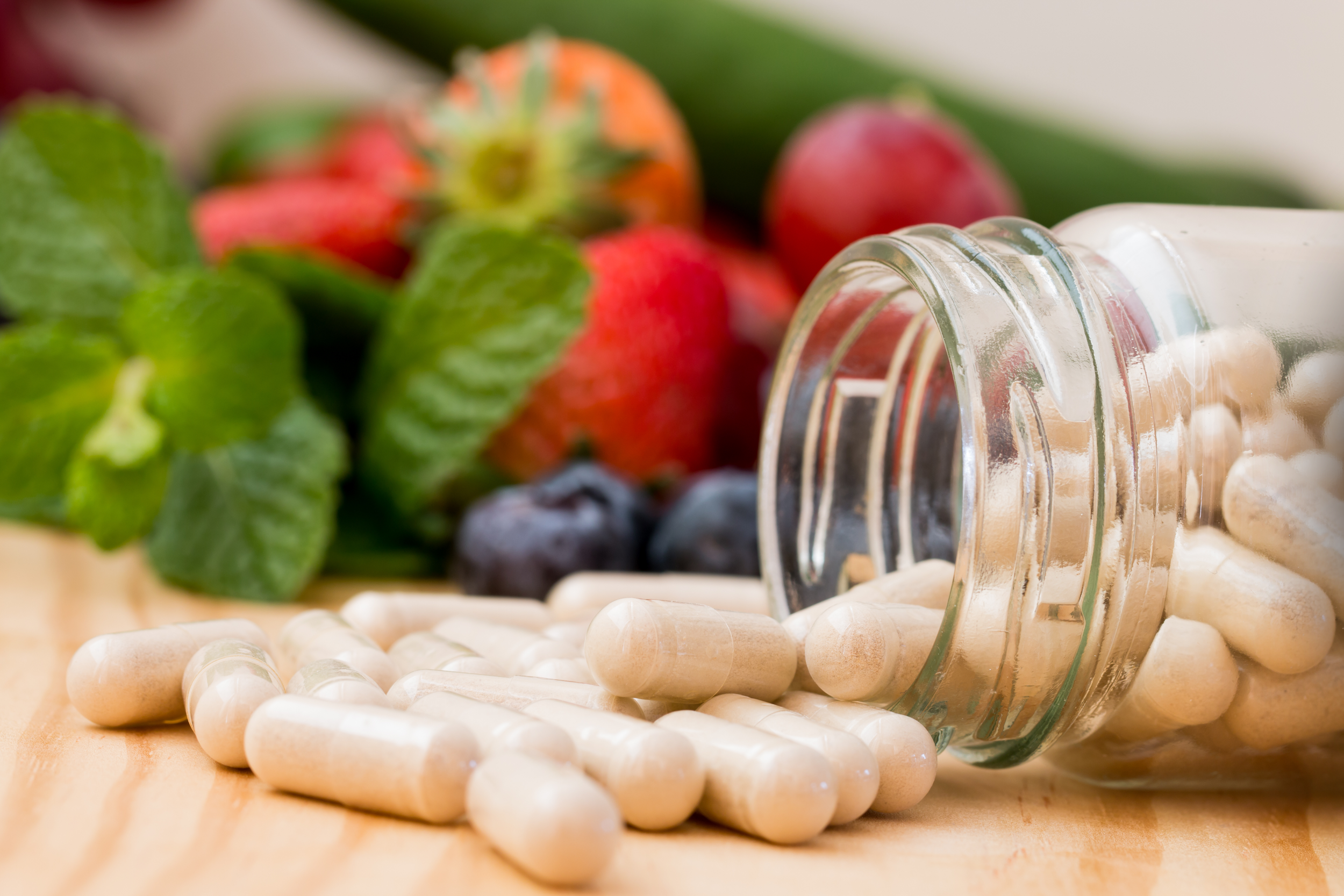 Supplements spill out of a jar