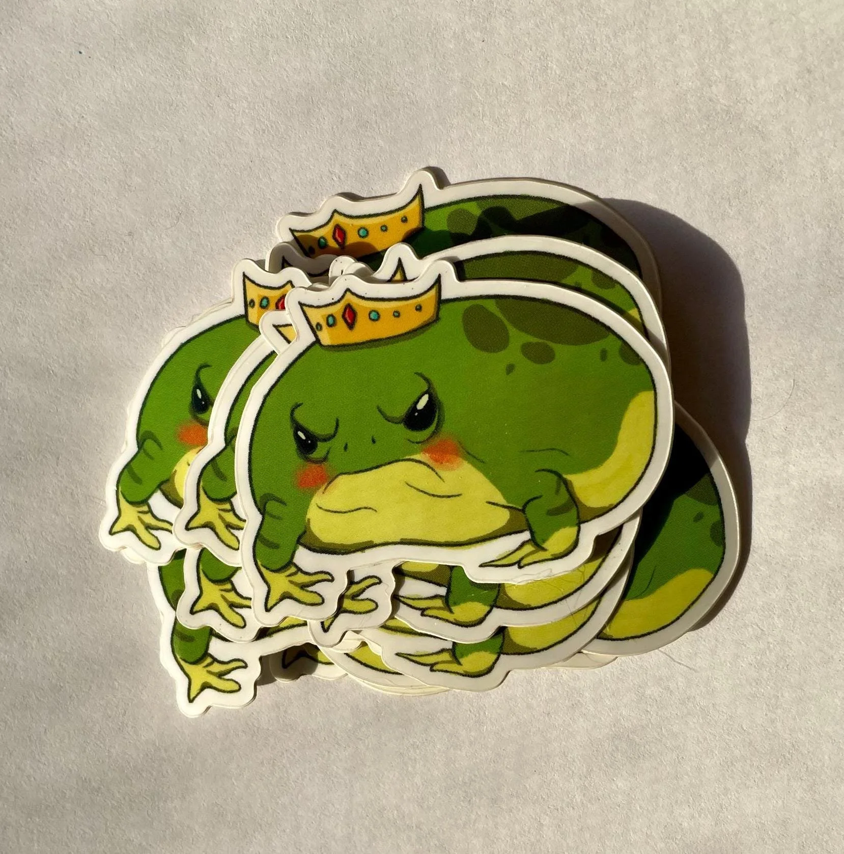 showing a pile of the front sticker