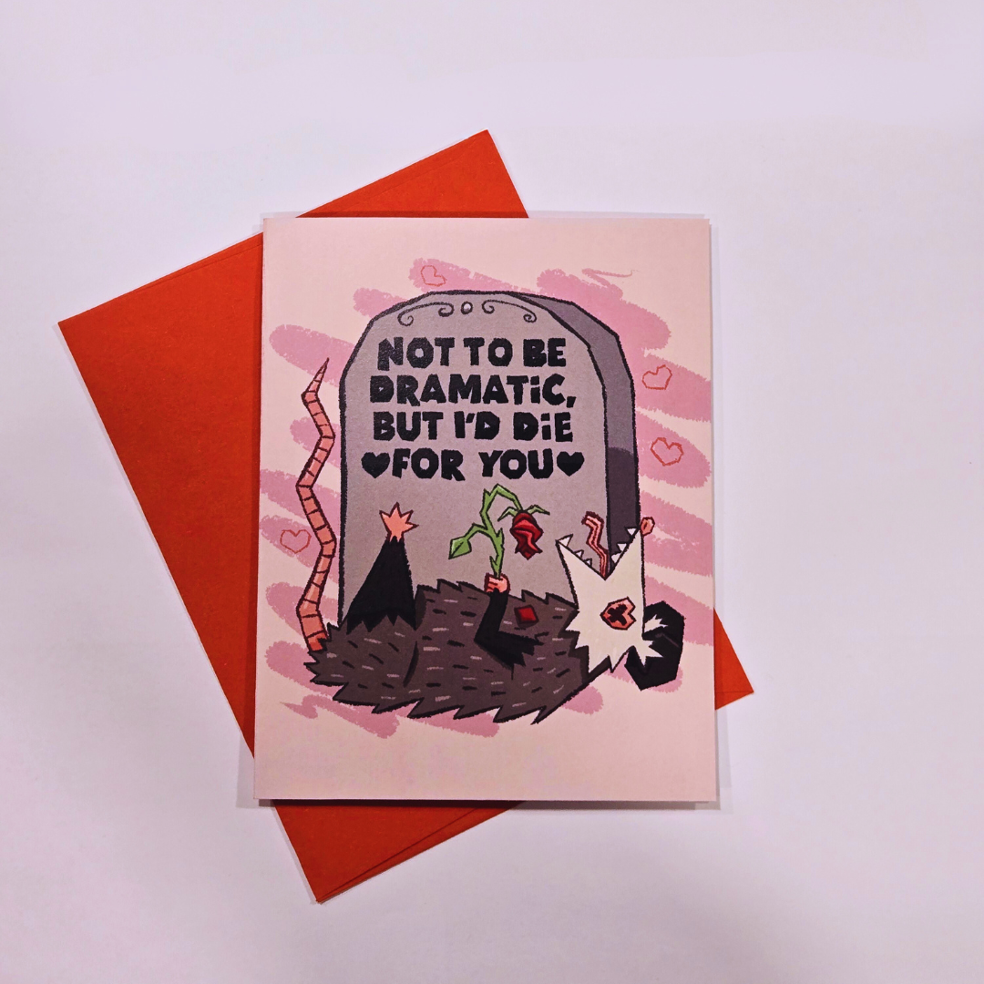 card with red envelope behind it