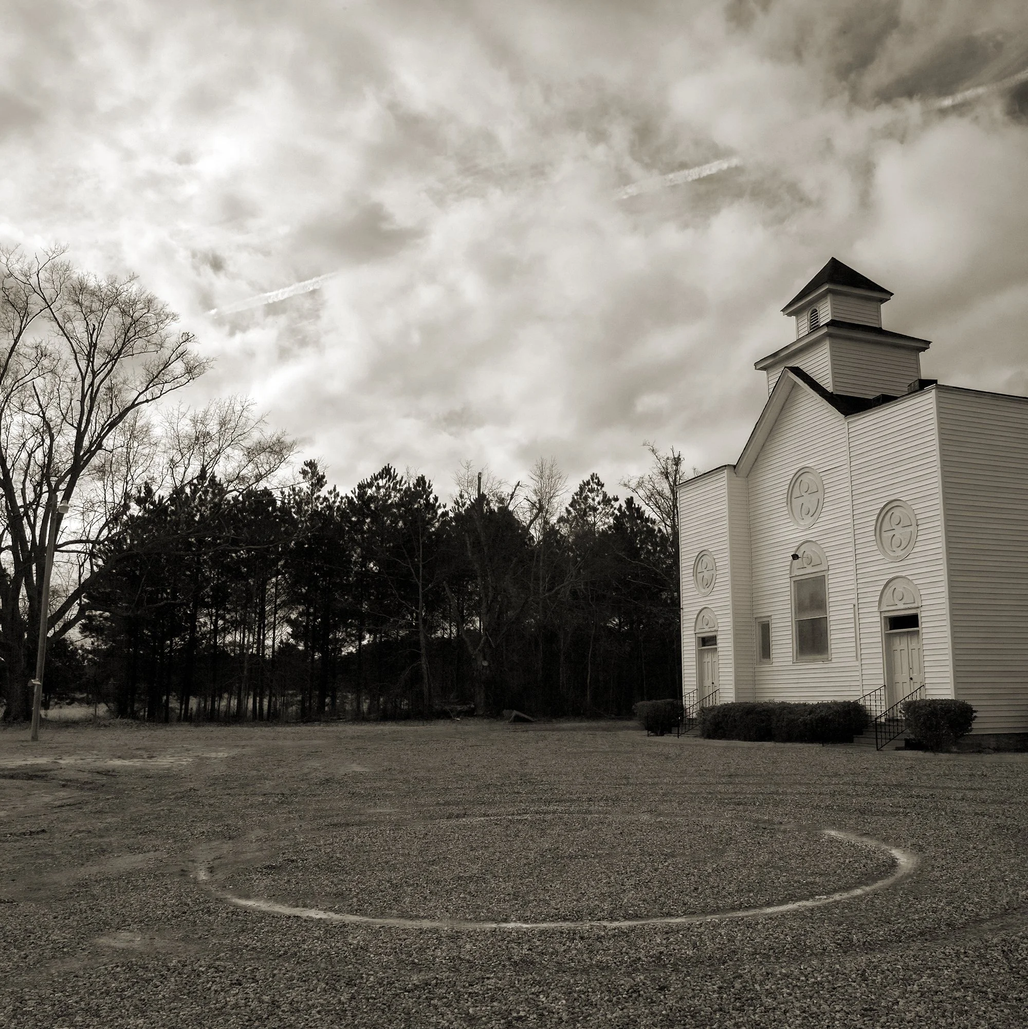 Midway Baptist with Vapor Trail.jpg