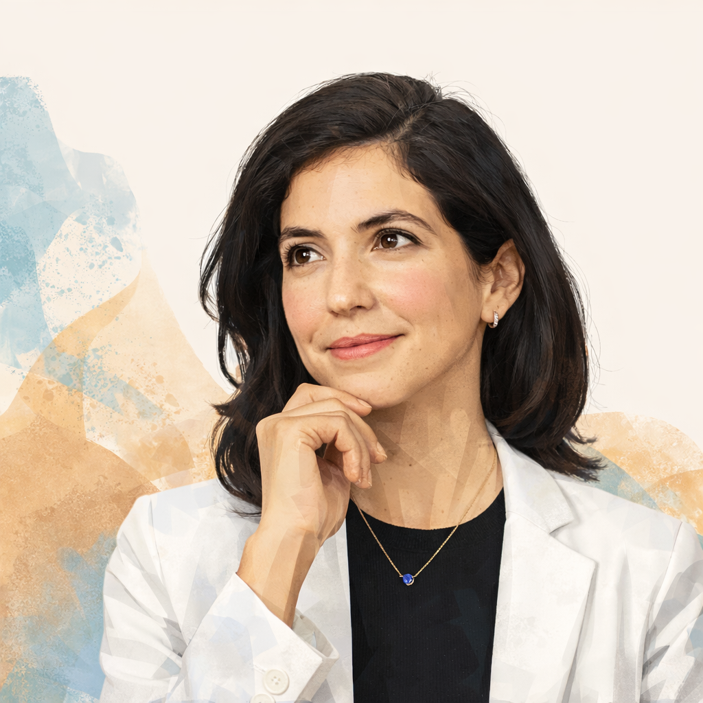 A woman with dark shoulder-length hair and light skin in a white lab coat, smiling gently and resting her chin on her hand, with a colorful abstract background.