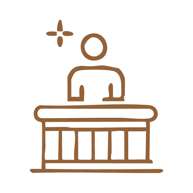 Simple line drawing of a judge sitting at a bench, with a gavel above and to the left. The judge is depicted with an oval head and rectangular body.