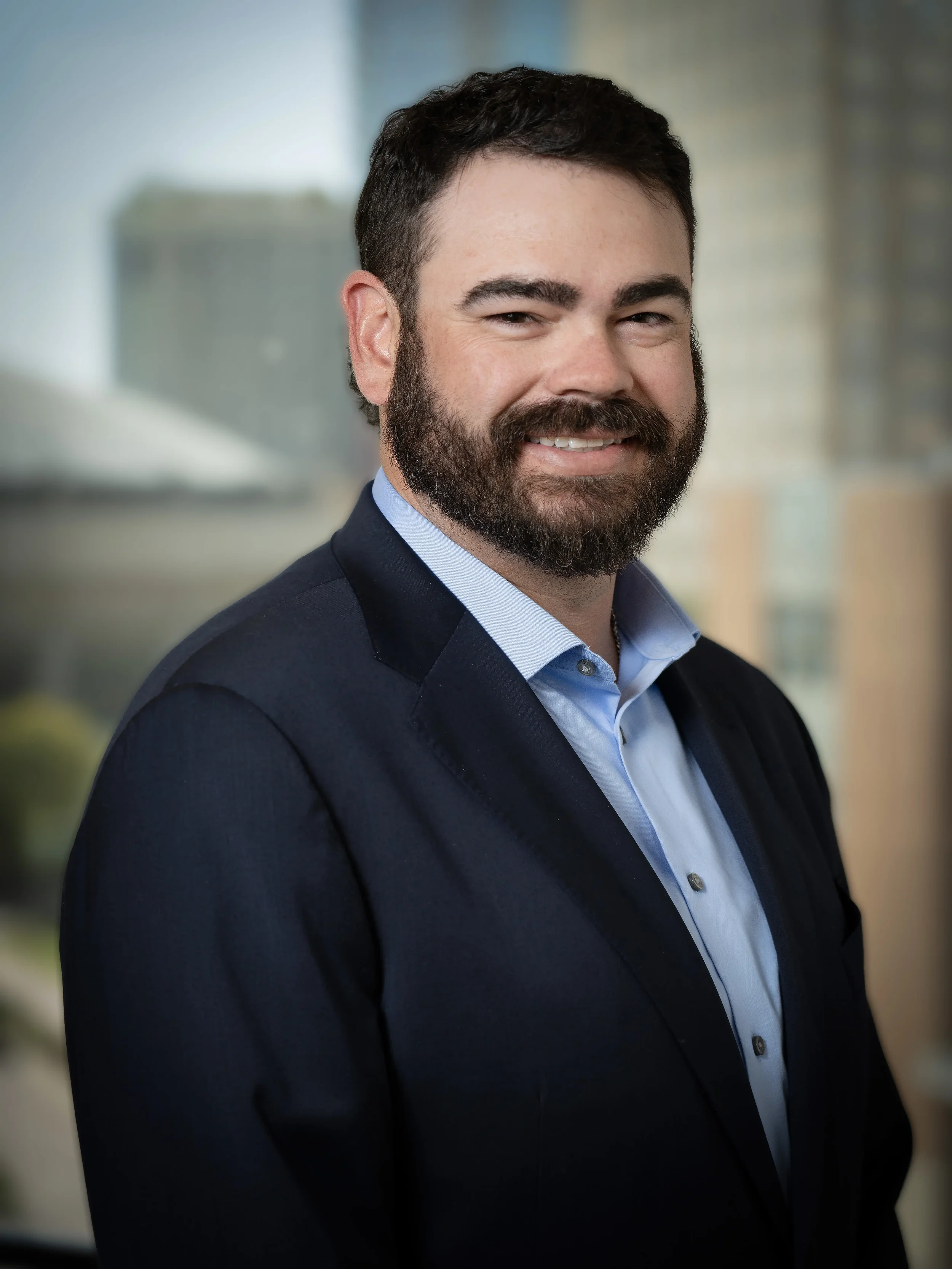 Clean executive headshot photographed in Ft. Worth with a soft environmental background. Designed for LinkedIn profiles, executive bios, and corporate branding