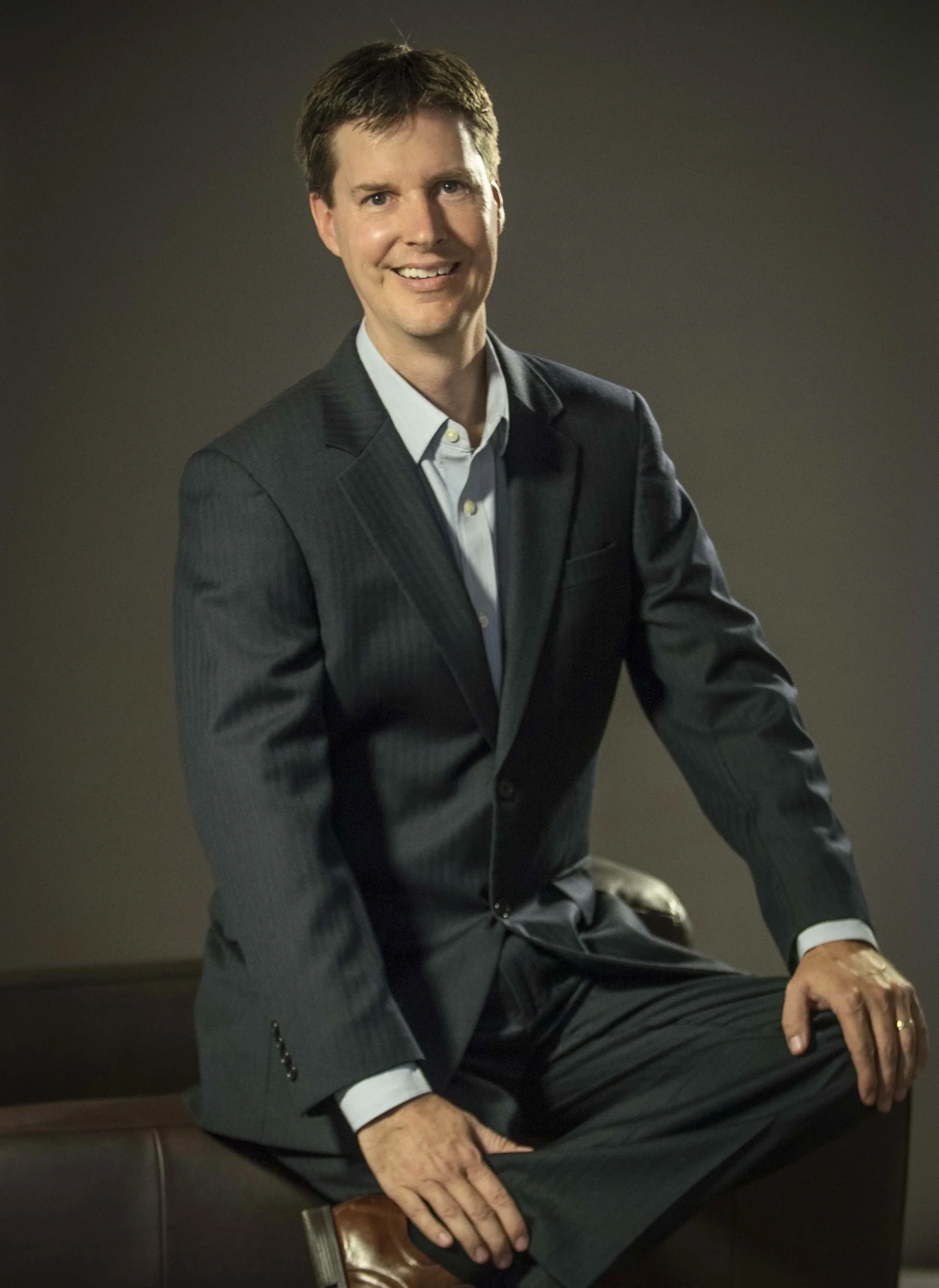 Studio-style executive portrait with polished lighting and professional styling, created for corporate branding and leadership profiles.