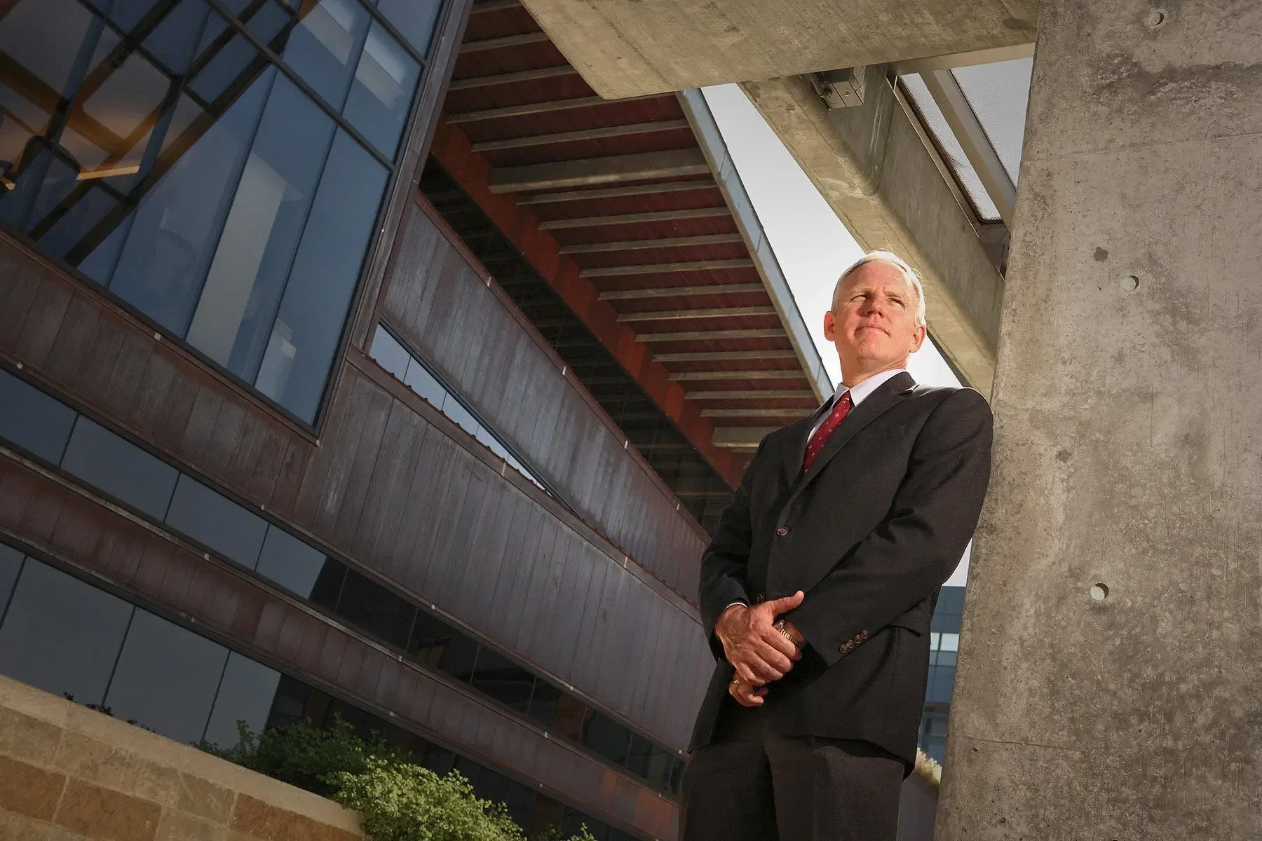 Corporate executive portrait photographed on location at a contemporary architectural project, highlighting leadership, confidence, and professional presence. This image showcases environmental corporate photography used for executive branding, corpo