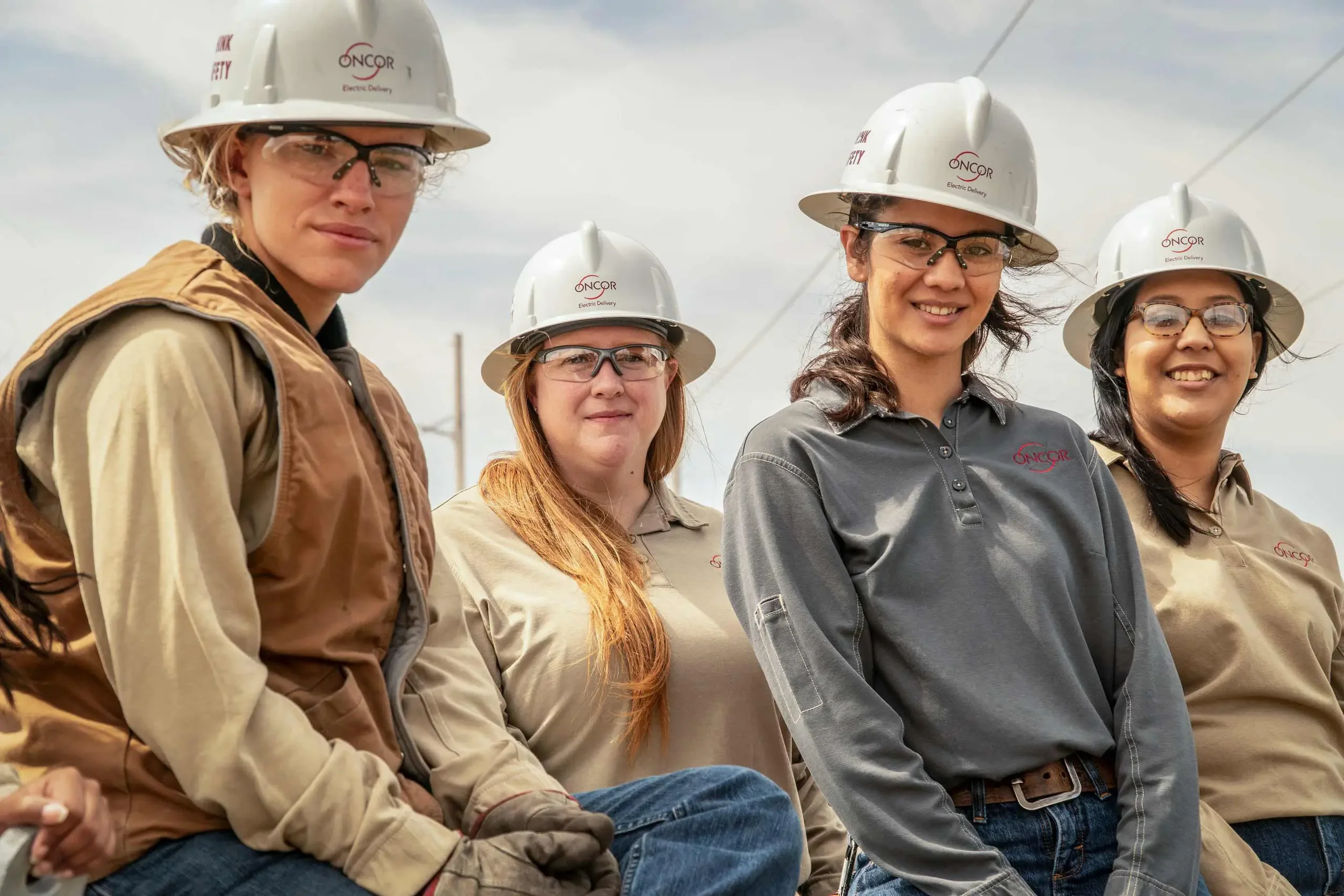Corporate lifestyle portrait of women professionals working together in the utilities and energy sector. This image emphasizes teamwork, diversity, and operational expertise, ideal for corporate communications, recruitment campaigns, and employer bra