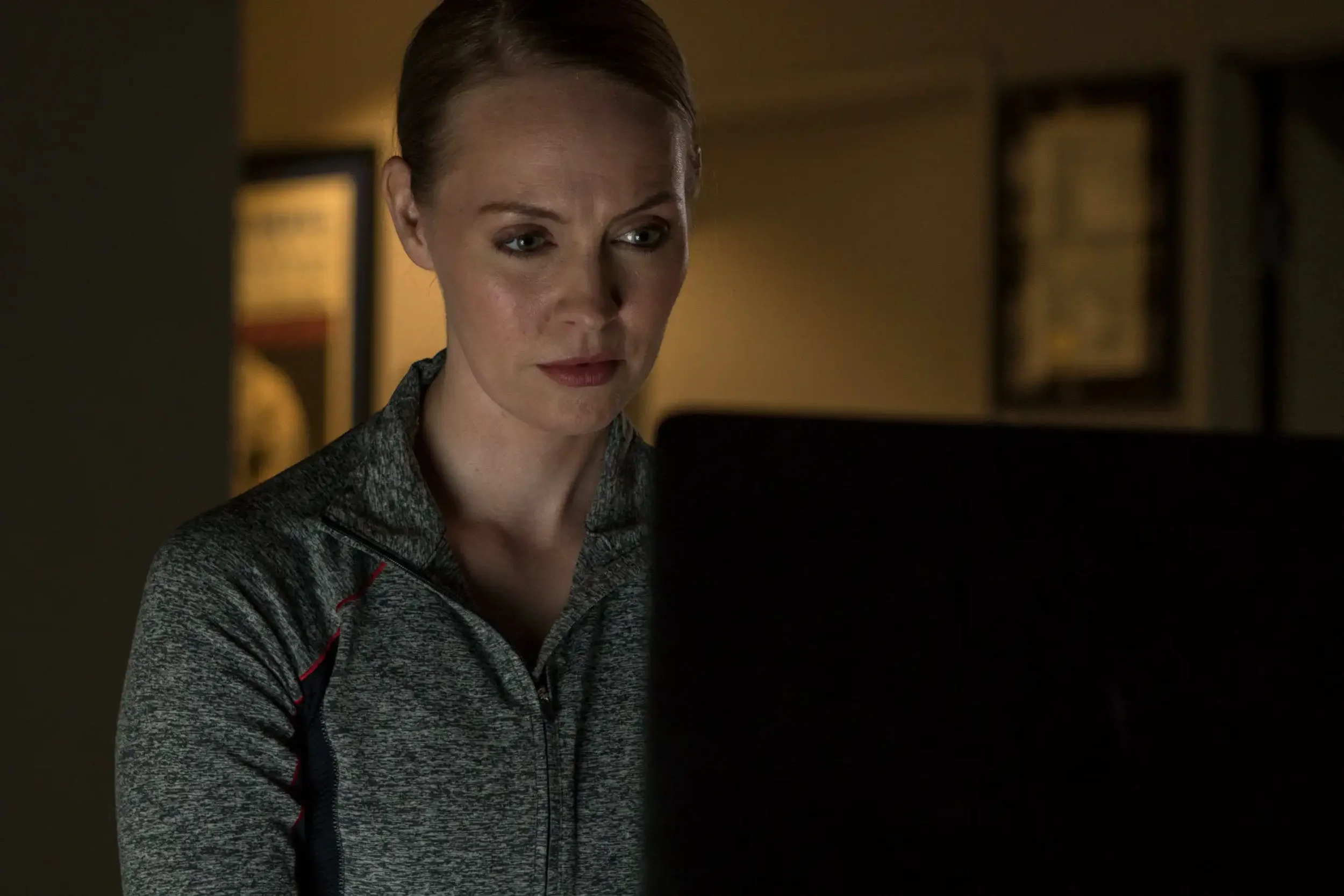 Corporate lifestyle portrait capturing a professional focused on work in a controlled indoor environment. This image reflects modern workplace culture and is ideal for corporate communications, technology branding, and business storytelling photograp