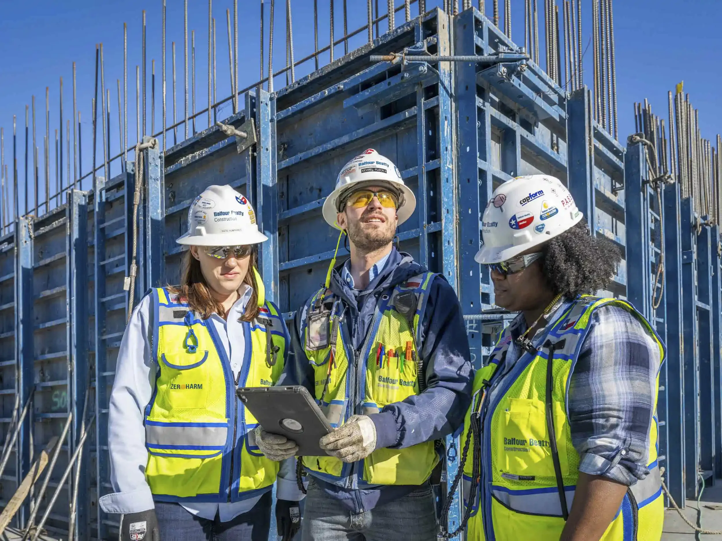 Dallas industrial construction photography of a project management team coordinating at an active jobsite. Professional documentation of commercial building operations and safety-first management by C Ray Pictures.