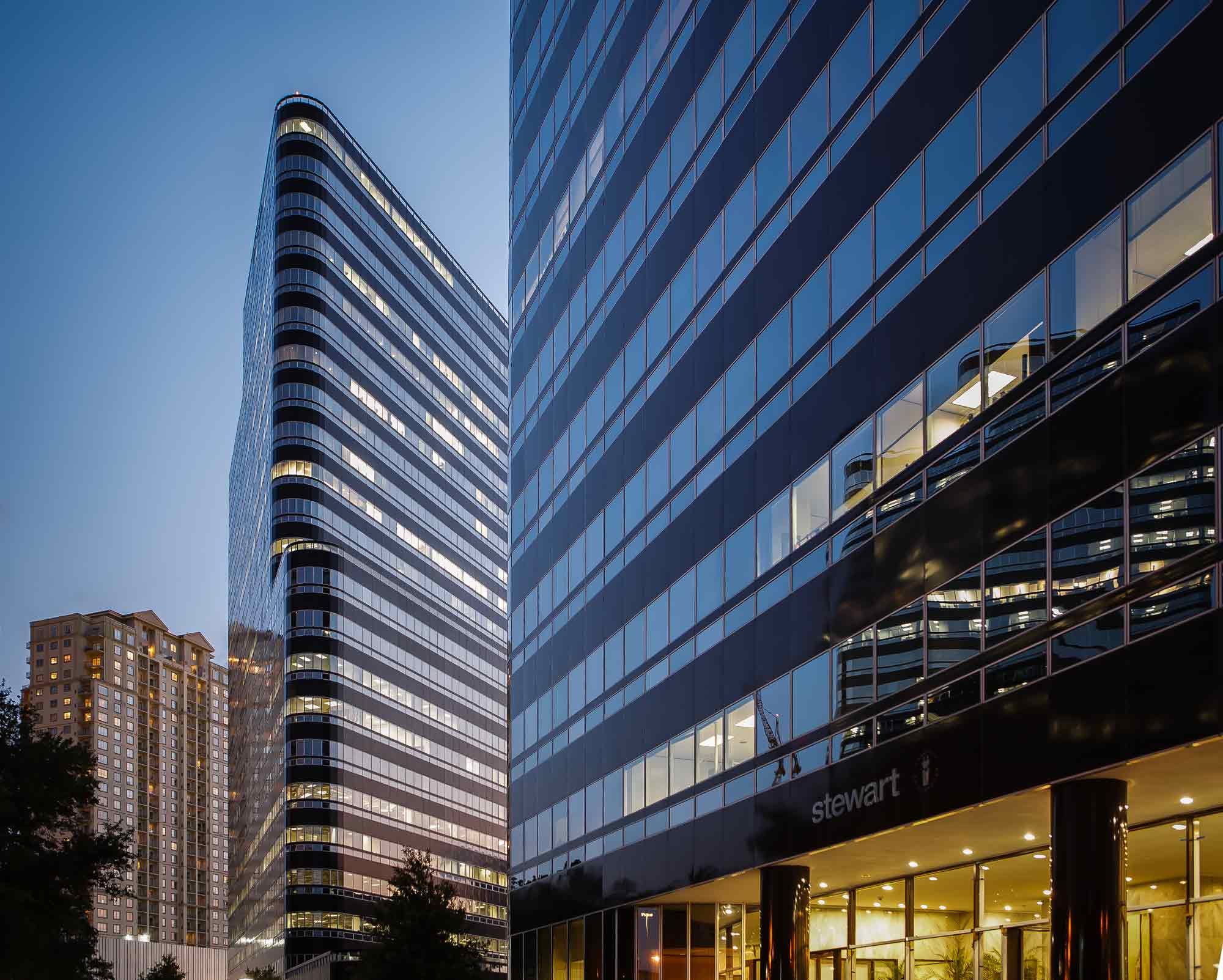 Stunning sunset view of commercial office buildings in the Post Oak Uptown area of Houston, captured by architectural photographer C Ray Pictures.
