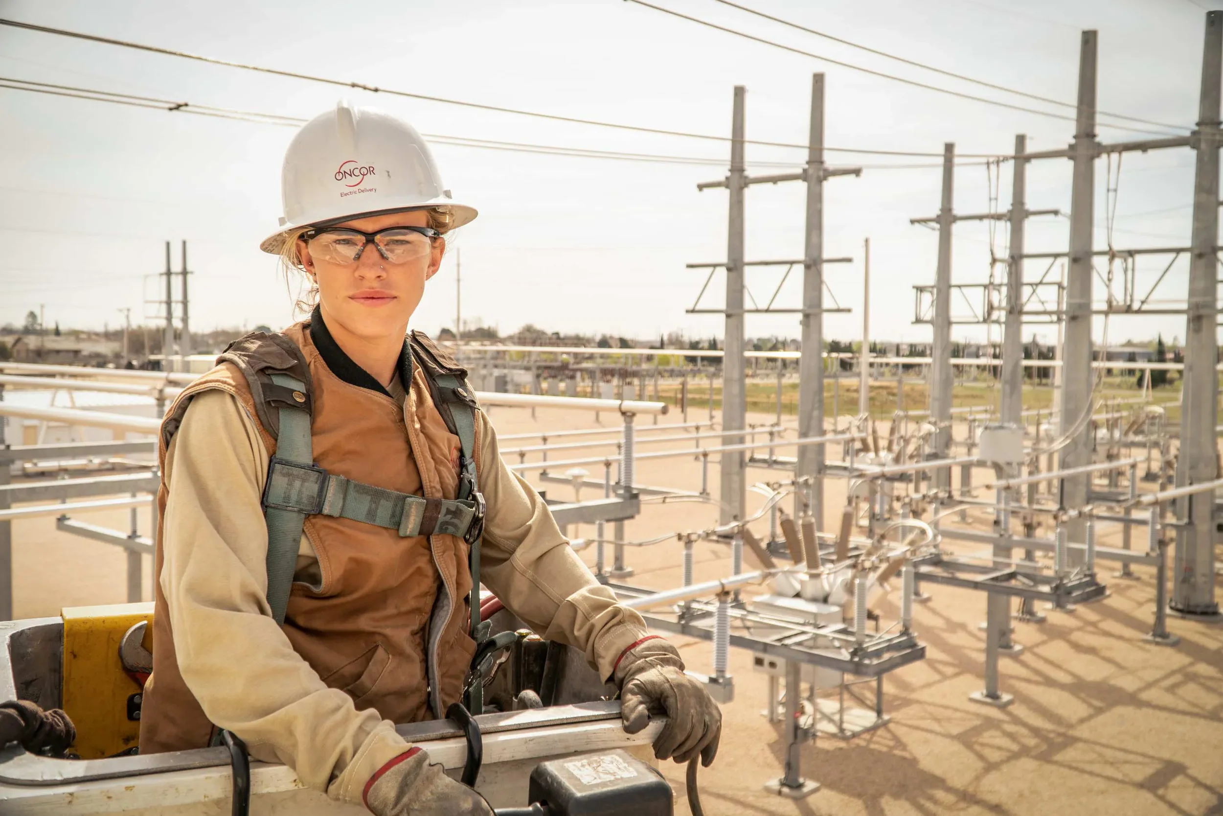 Environmental corporate portrait of an energy professional photographed on location at an electrical substation. This image highlights leadership, safety awareness, and operational expertise, ideal for energy companies, utilities, and corporate brand