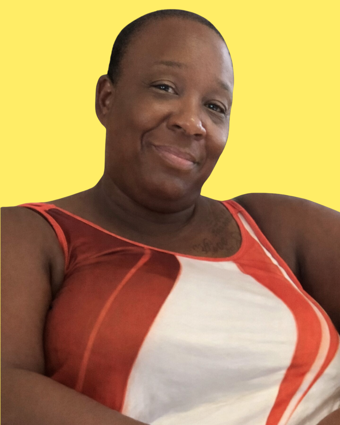 Portrait of a woman wearing a red and white sleeveless top, smiling, with a yellow background.