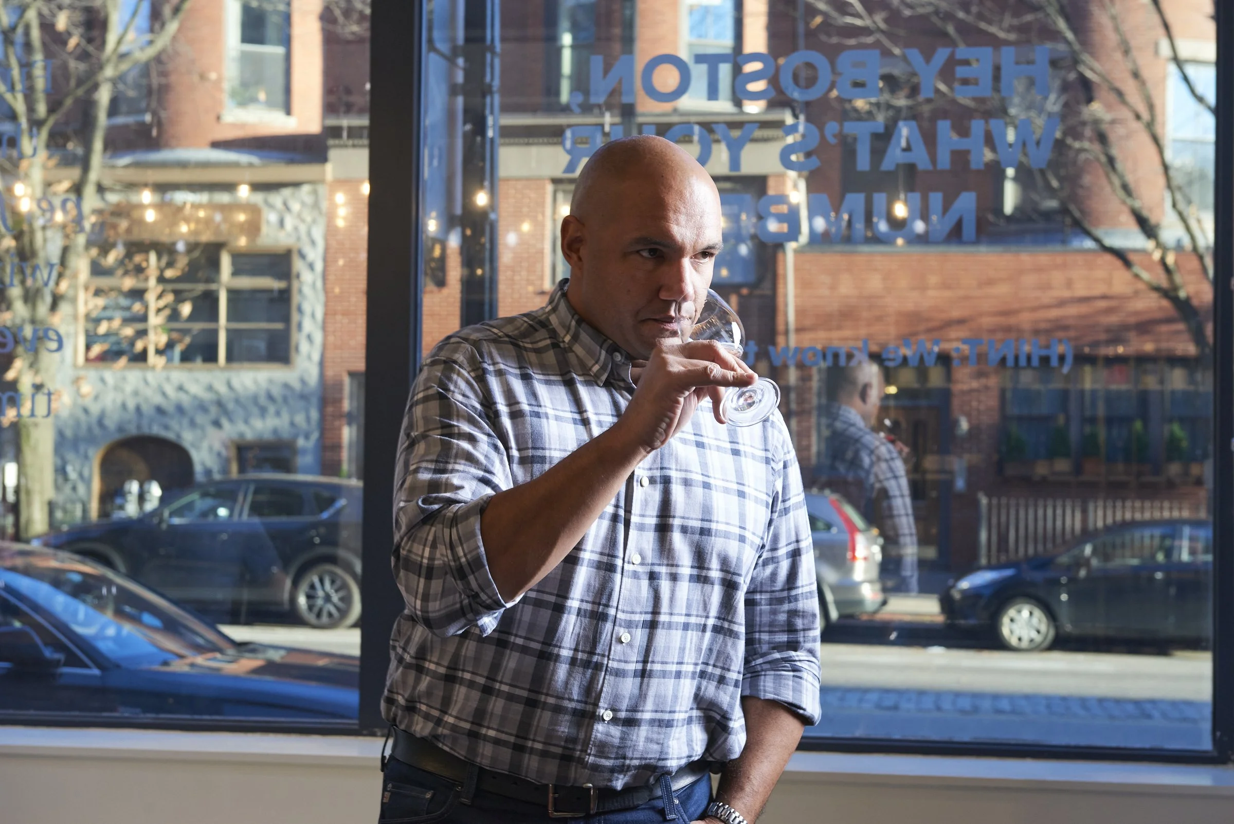 TJ Douglas hosting a wine tasting event in Boston for a corporate group