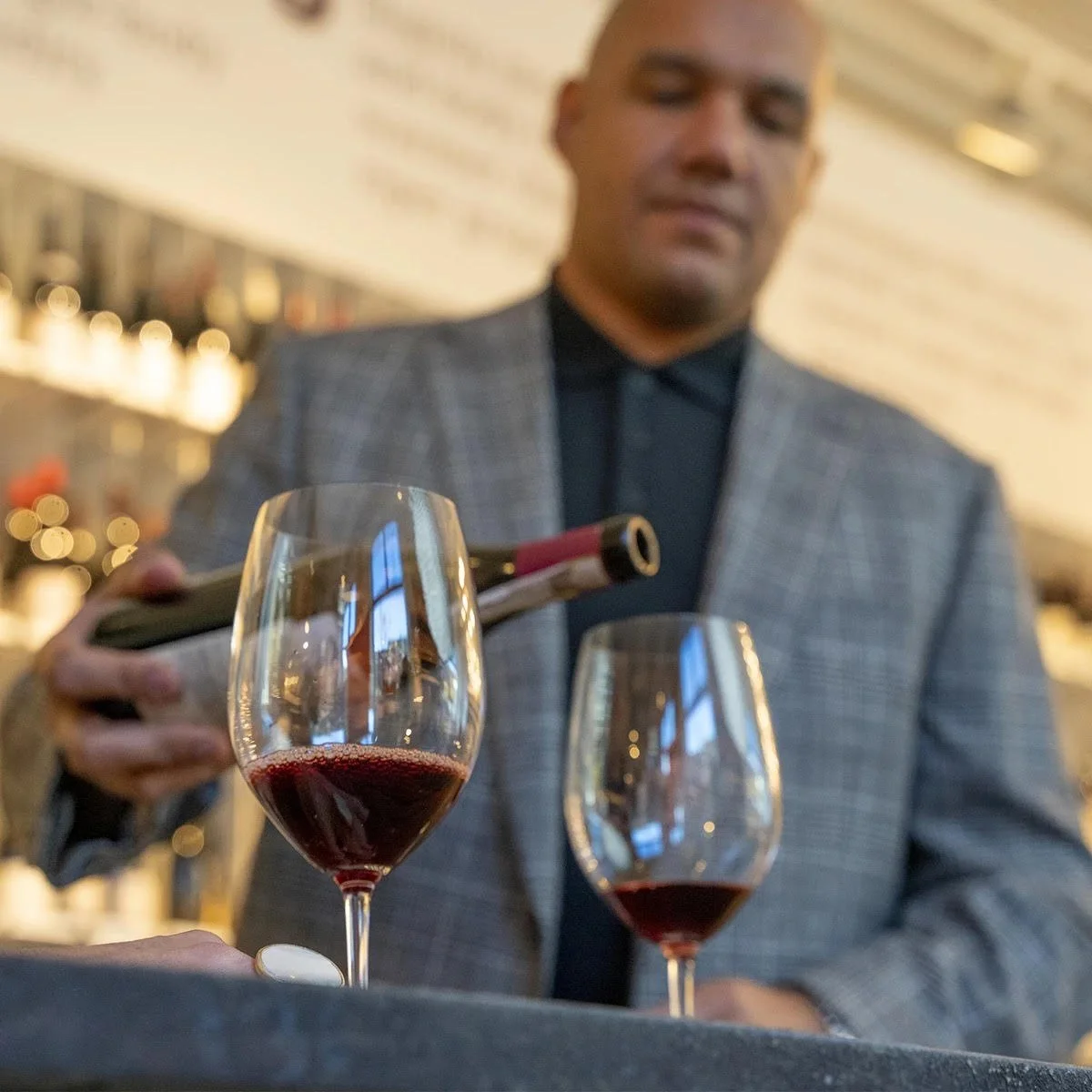 TJ Douglas Boston wine cellar consultant reviewing a wine collection during a cellar consultation