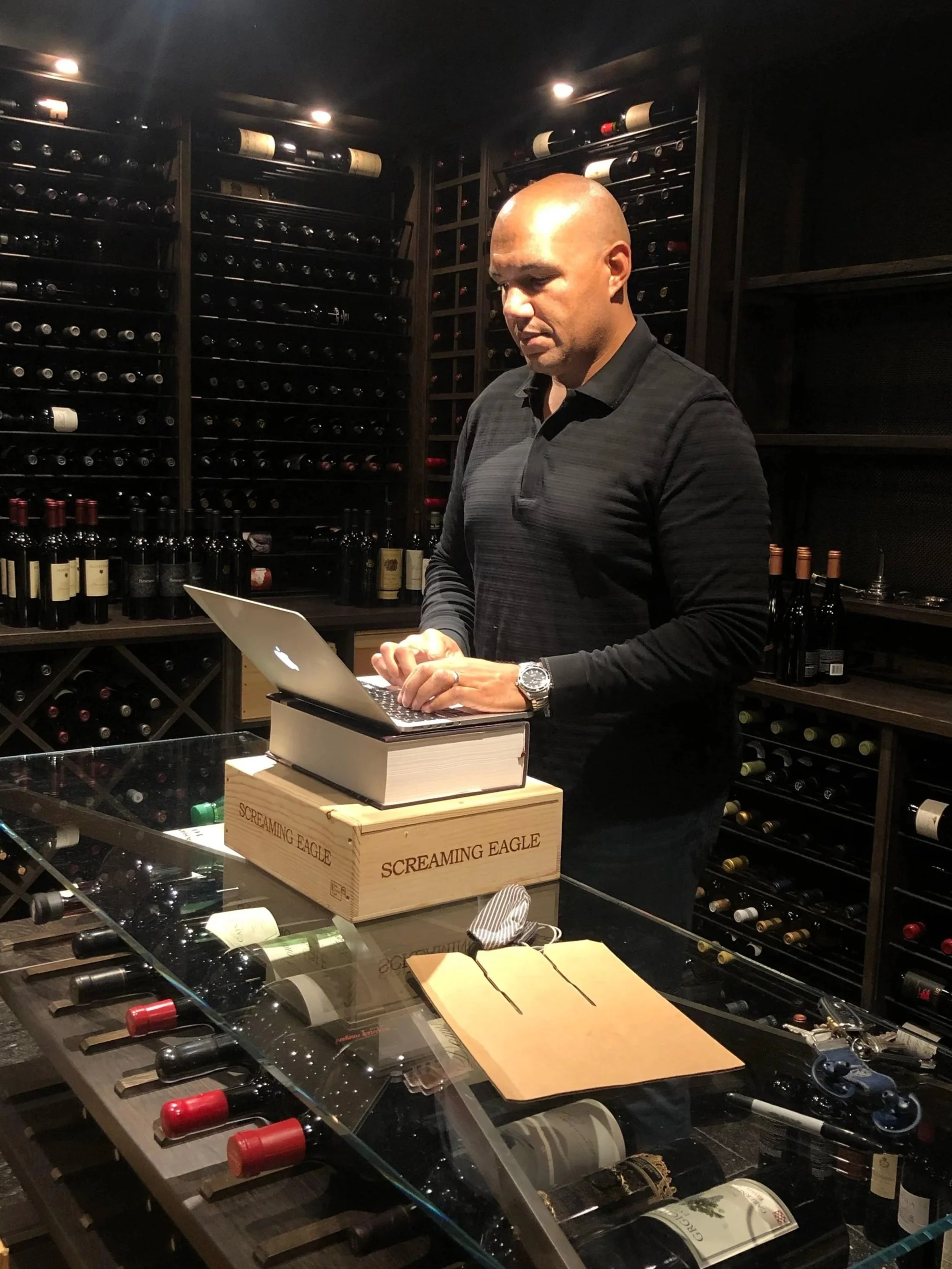 TJ Douglas leading a private wine cellar consultation, reviewing his client's wine cellar