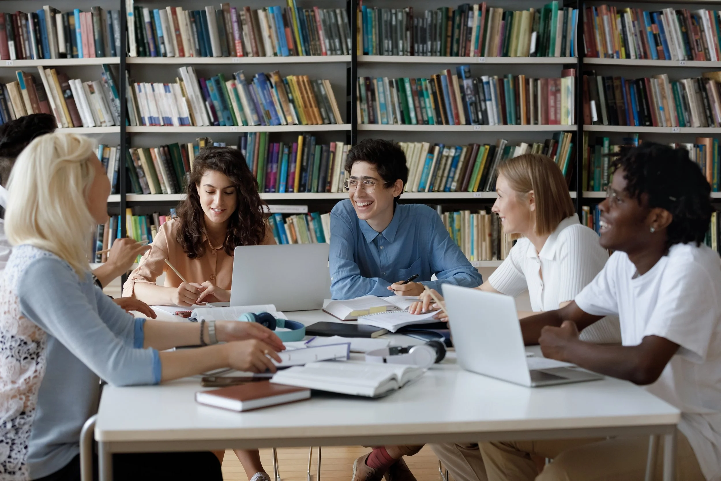 A diverse group in an IEP meeting using the JenEd Enterprises software system iIEP and iS3.