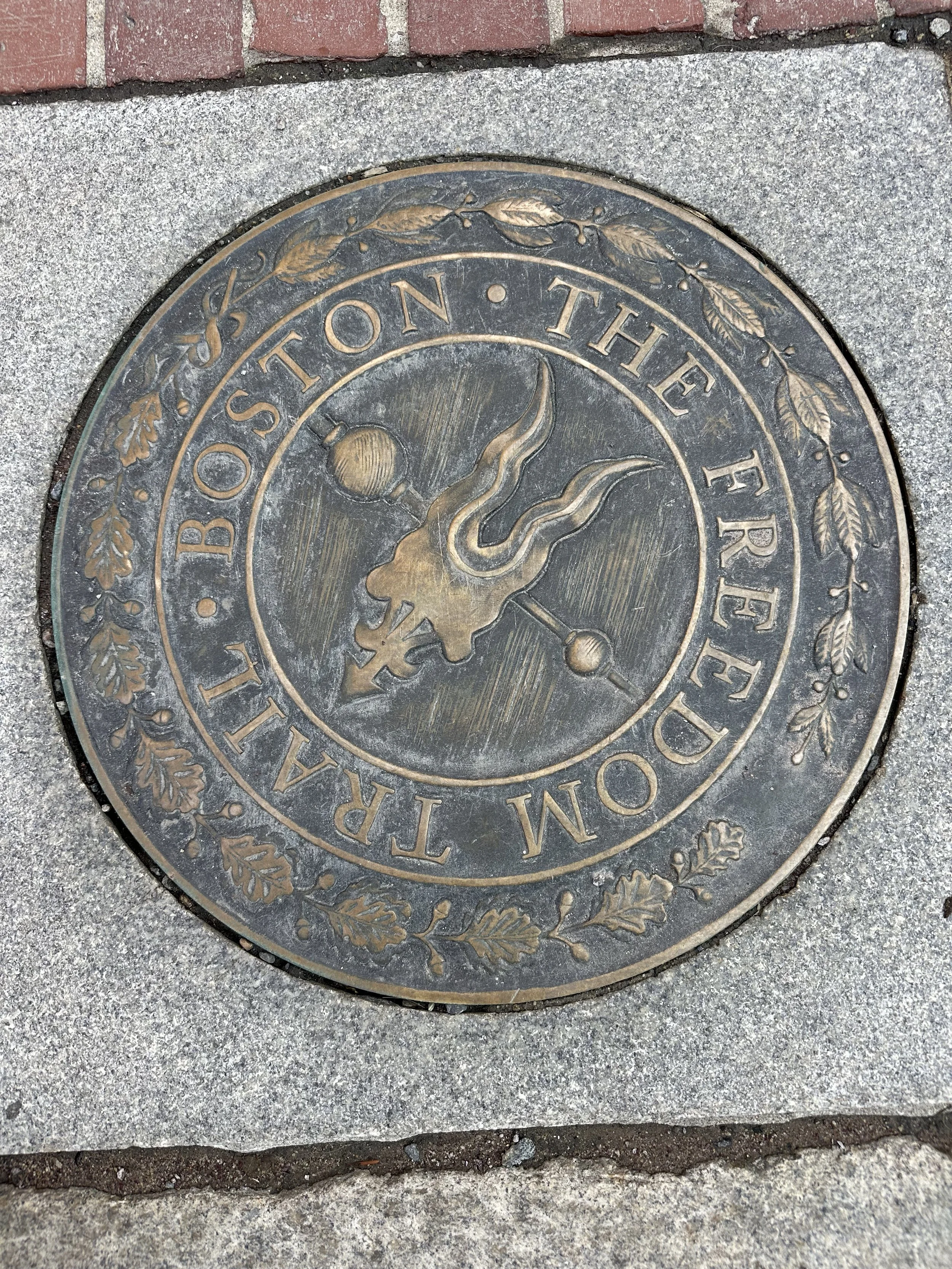 Freedom Trail marker highlighting Boston Revolutionary War history on a private walking tour